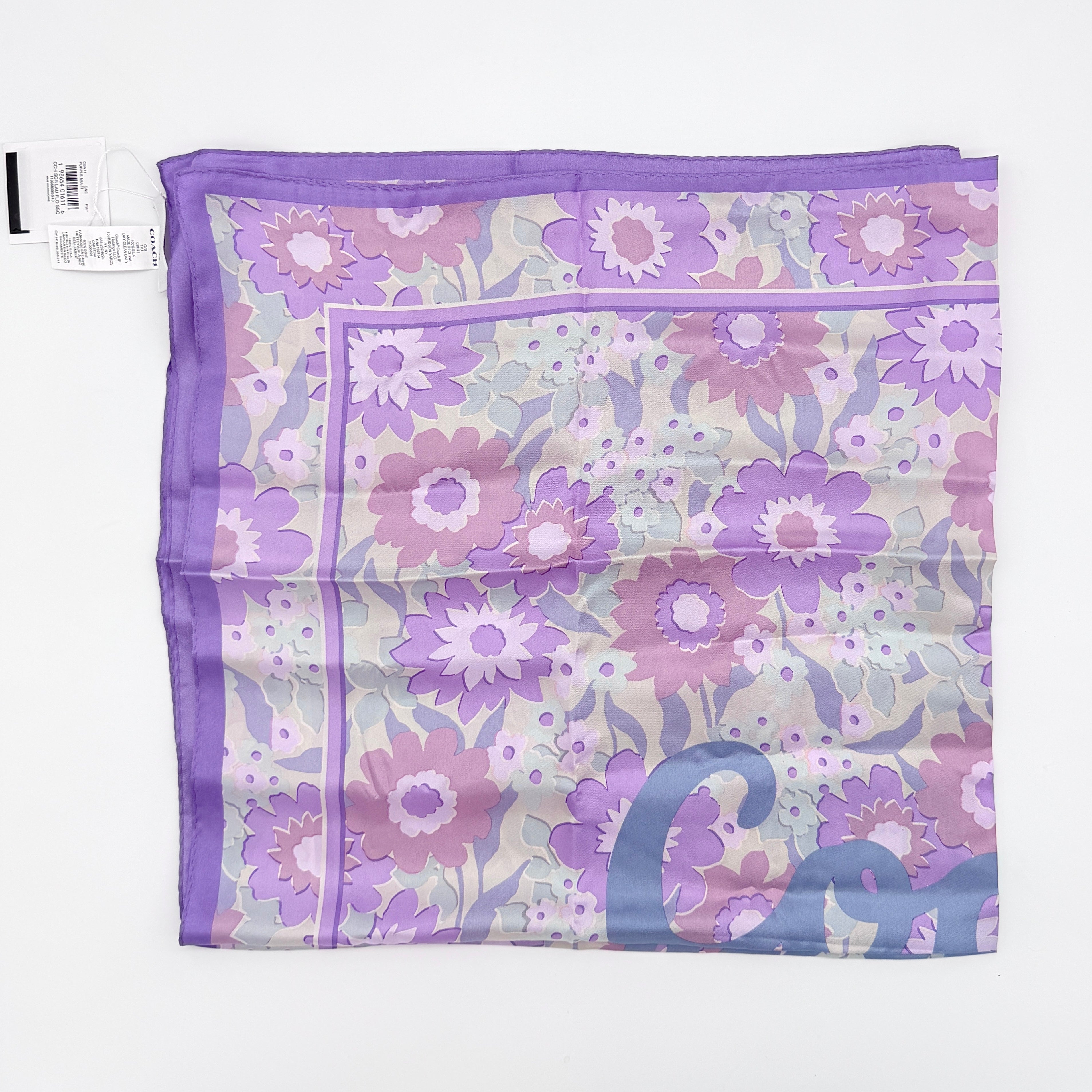 Coach floral silk scarf in purple with logo, presented with original packaging and tags.