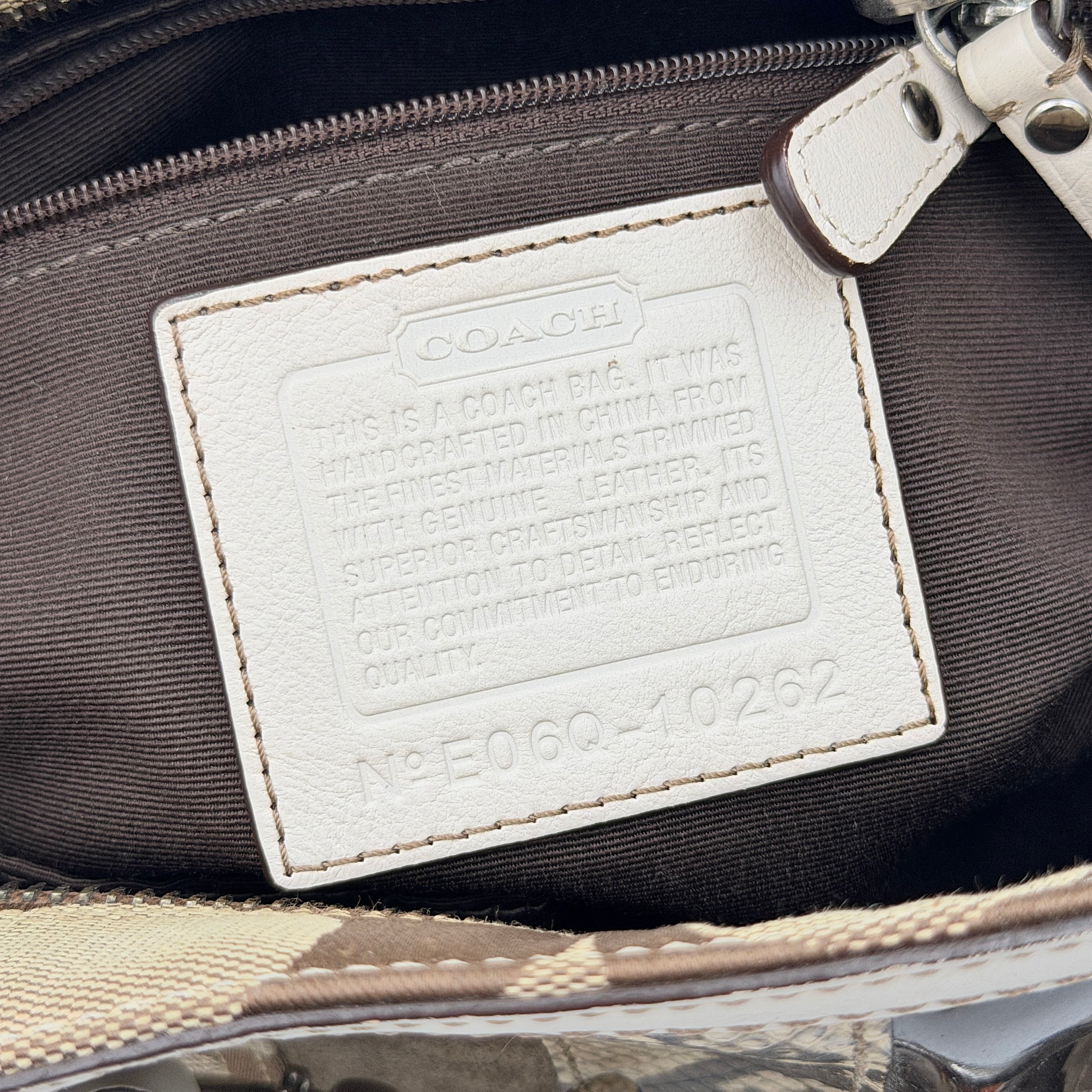 Coach Signature Hampton Python Stripe Handbag in multicolour leather and canvas with silver-tone hardware and an orange scarf detail.