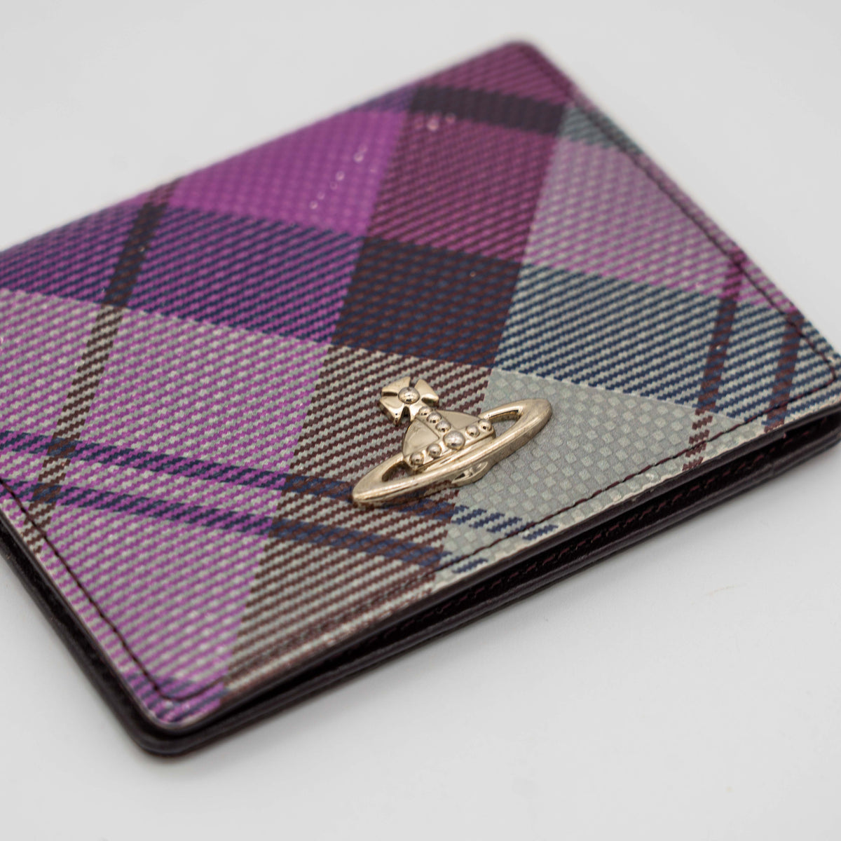 Vivienne Westwood card case in purple tartan canvas with gold Orb logo and burgundy leather interior.
