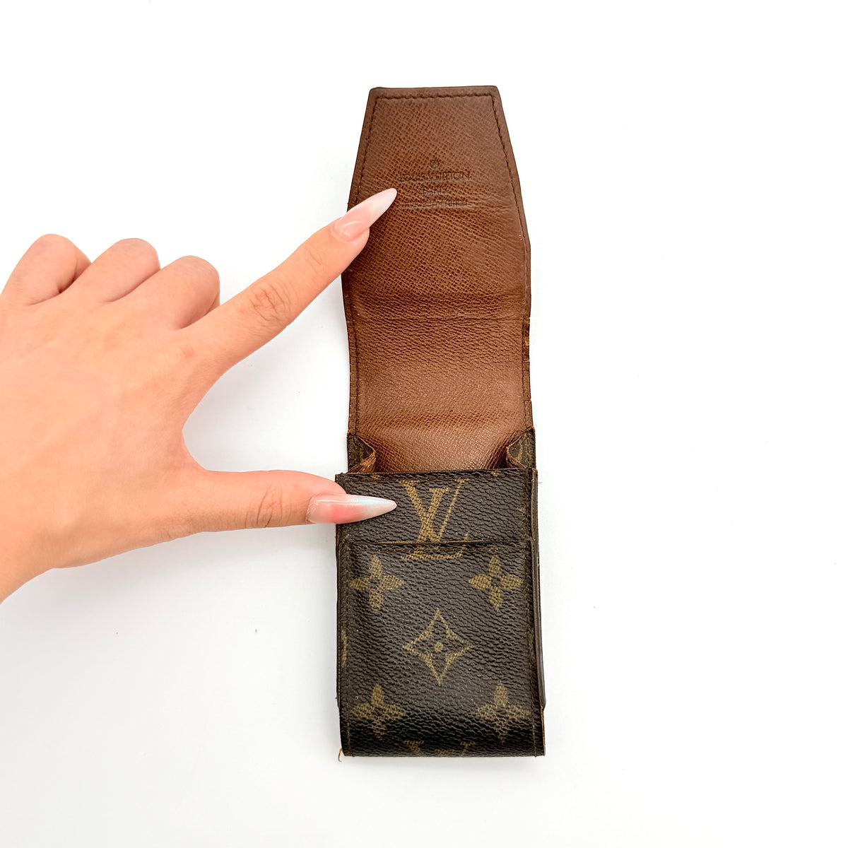Louis Vuitton Monogram Cigarette Case in brown canvas with flap opening, photographed front-facing on a white background.