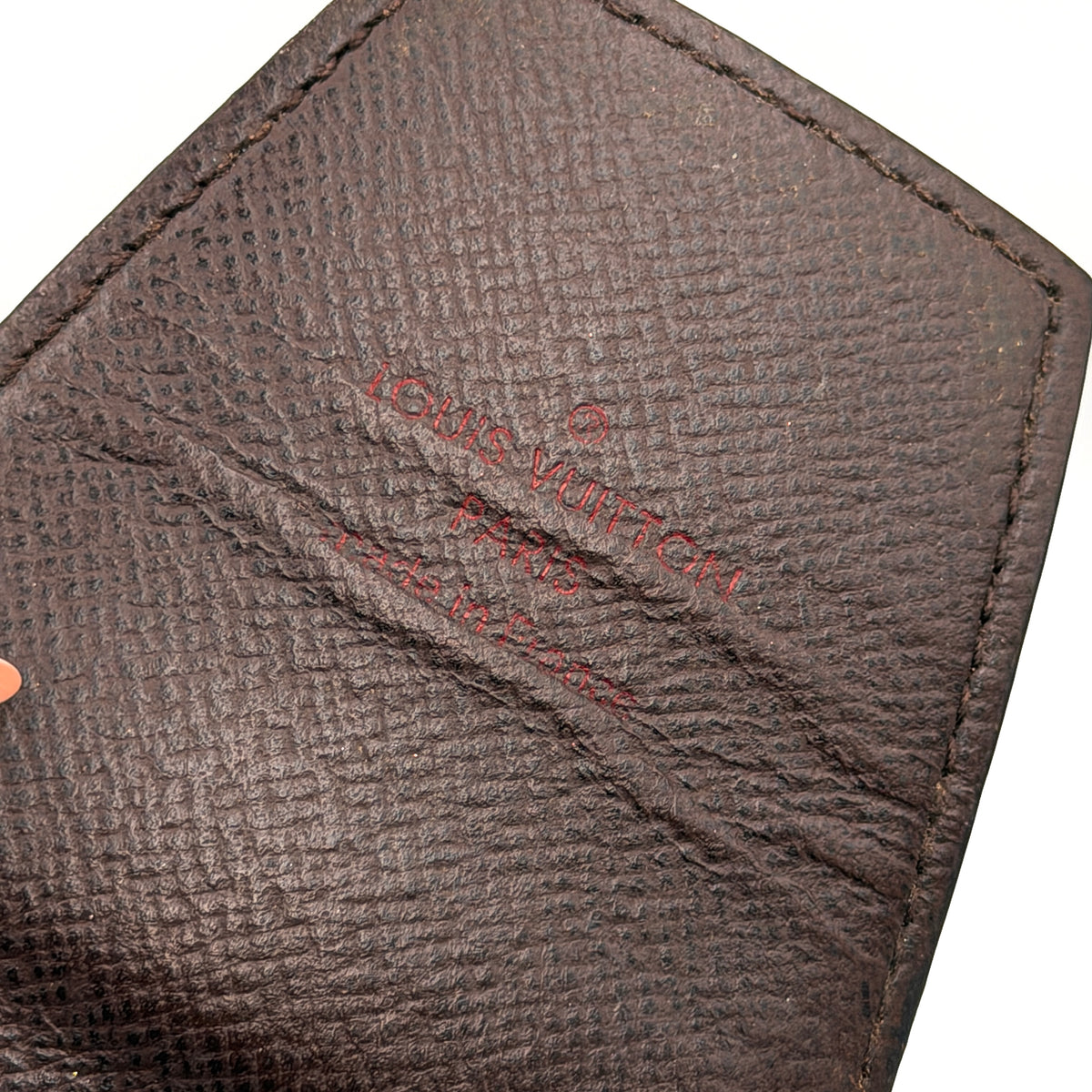 Louis Vuitton Damier Ebene Cigarette Case in brown coated canvas with original box, dust bag, and cards displayed.