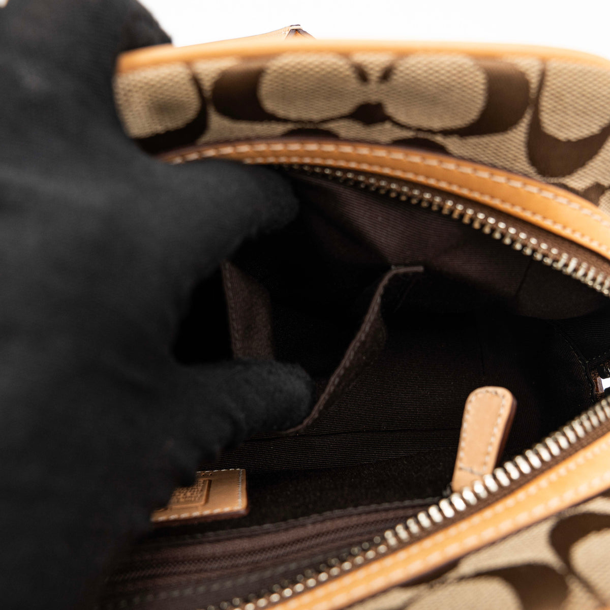 Coach Signature Hampton Satchel Boston Bag in beige and tan canvas with leather trim and silver hardware, styled on a clean background.