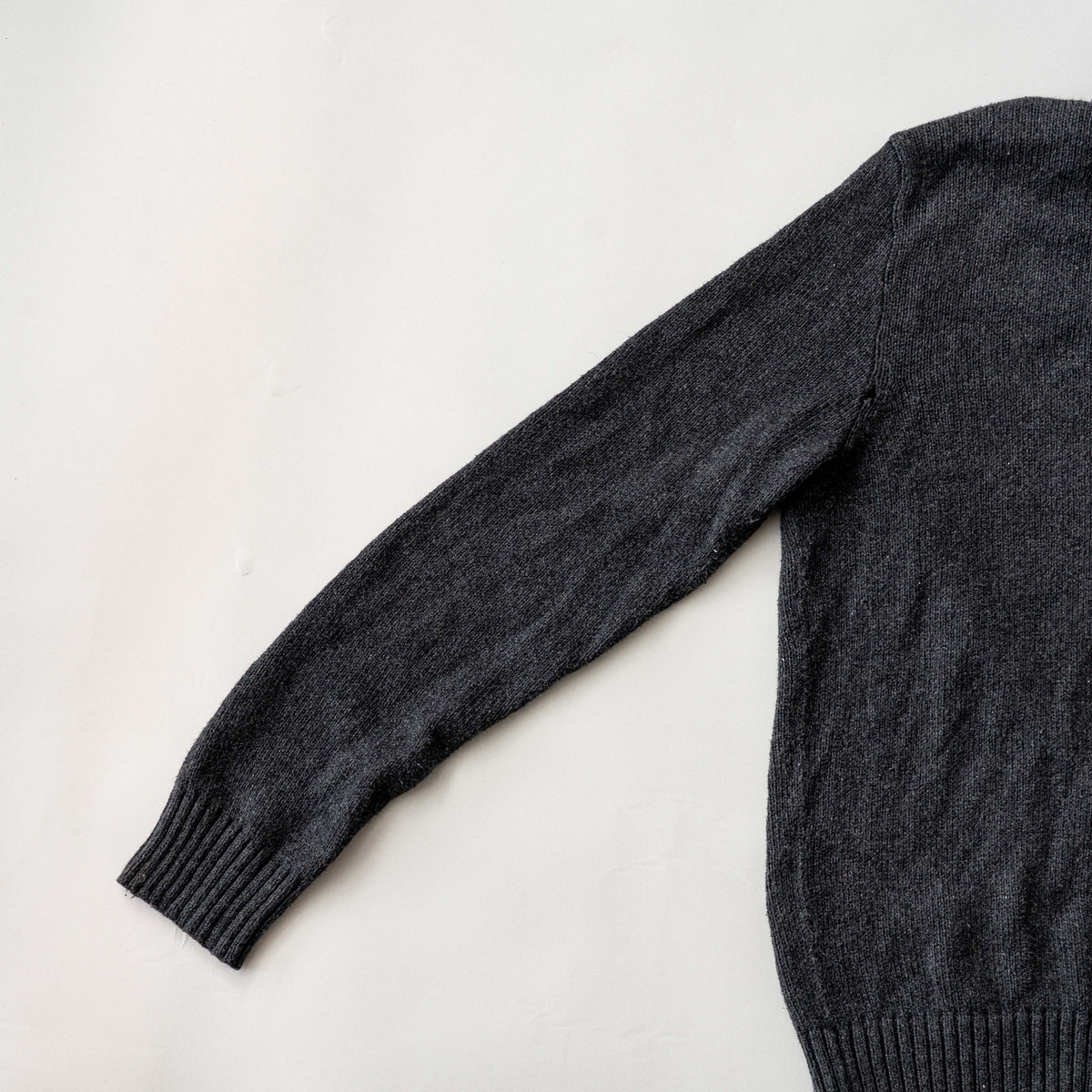Dark grey Polo Ralph Lauren quarter zip mockneck pullover sweater with ribbed collar and green pony logo.