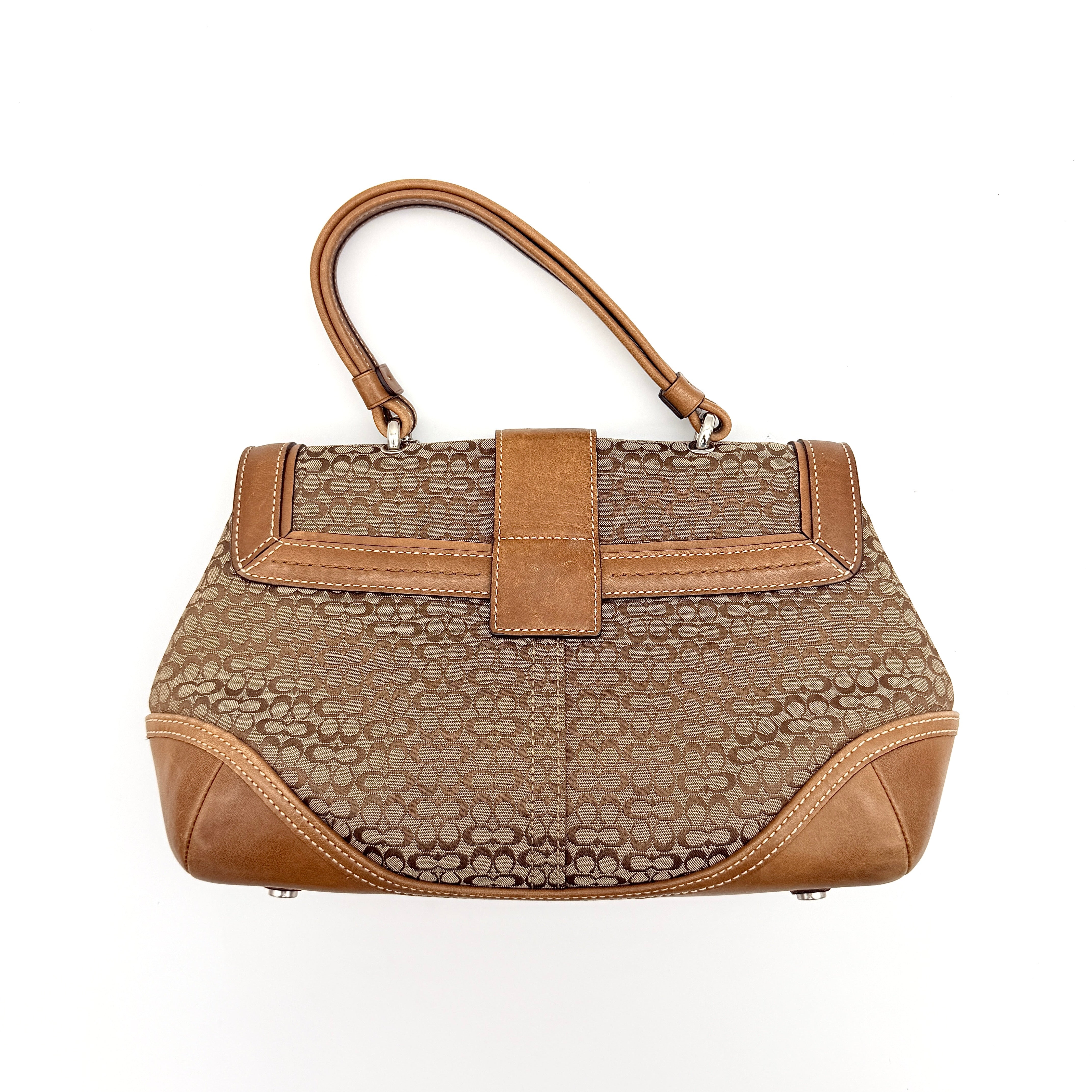 Coach Signature Soho Shoulder Bag in beige and tan monogram canvas with tan leather trim, shown on white background.