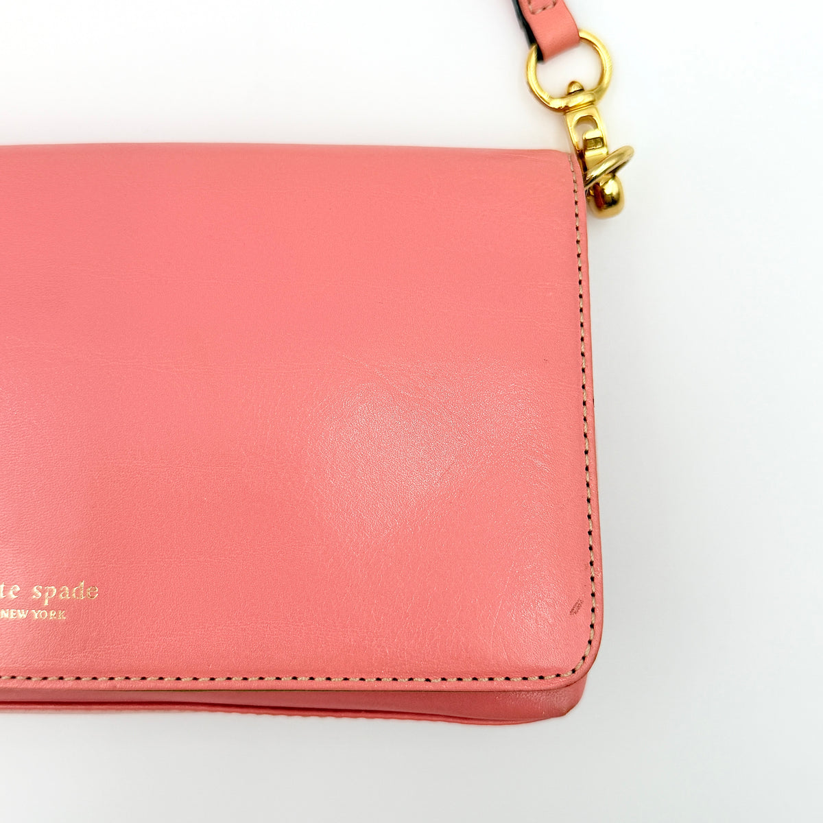 Kate Spade Morgan East West Shoulder Bag in smooth pink leather with gold-tone hardware and a green interior, displayed on white background.
