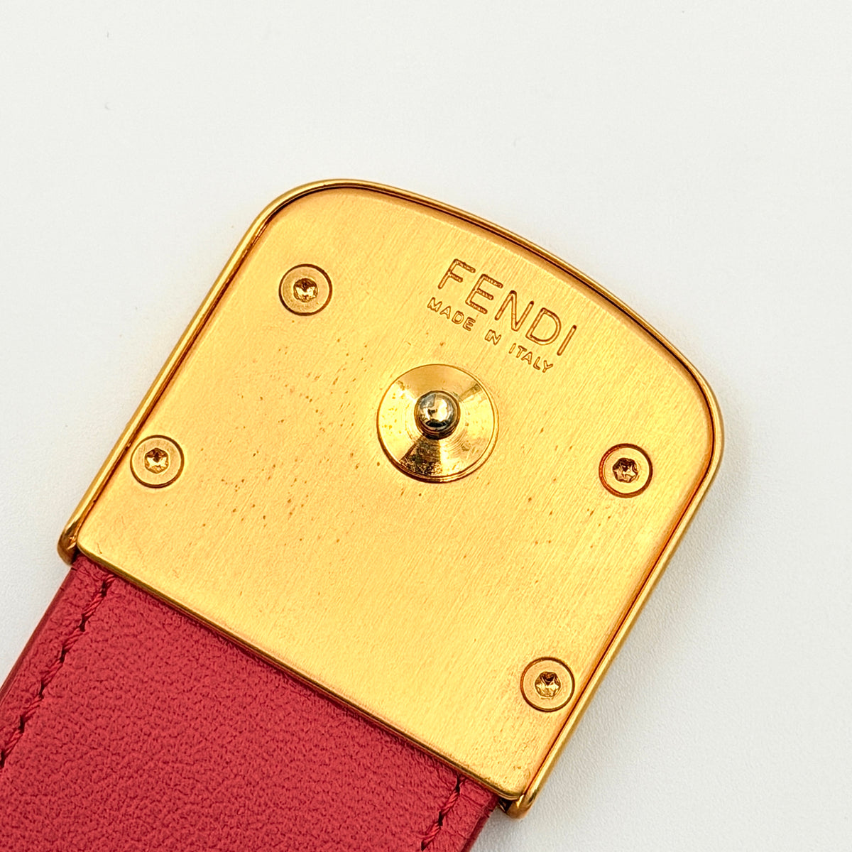 Fendi FF Logo Buckle Flap Continental Wallet in red leather with gold hardware, displayed closed on a white background.