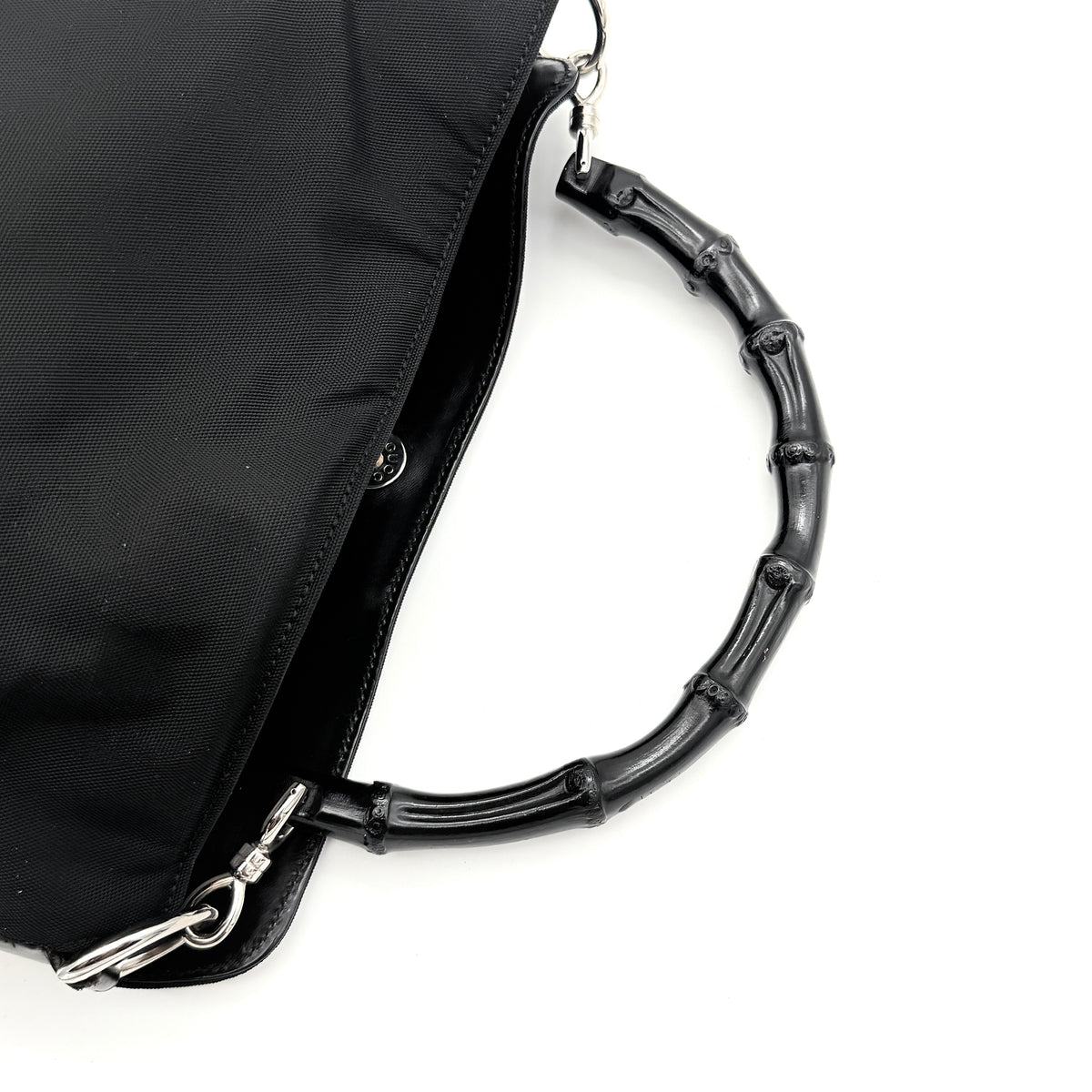 Gucci black nylon shoulder bag with bamboo handle and detachable strap shown with dust bag.