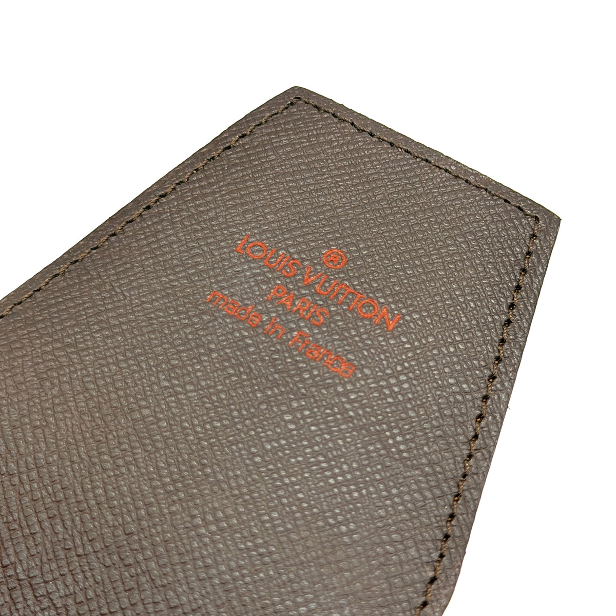 Louis Vuitton Damier Ebene canvas cigarette case with flap closure in brown, shown on a white background.