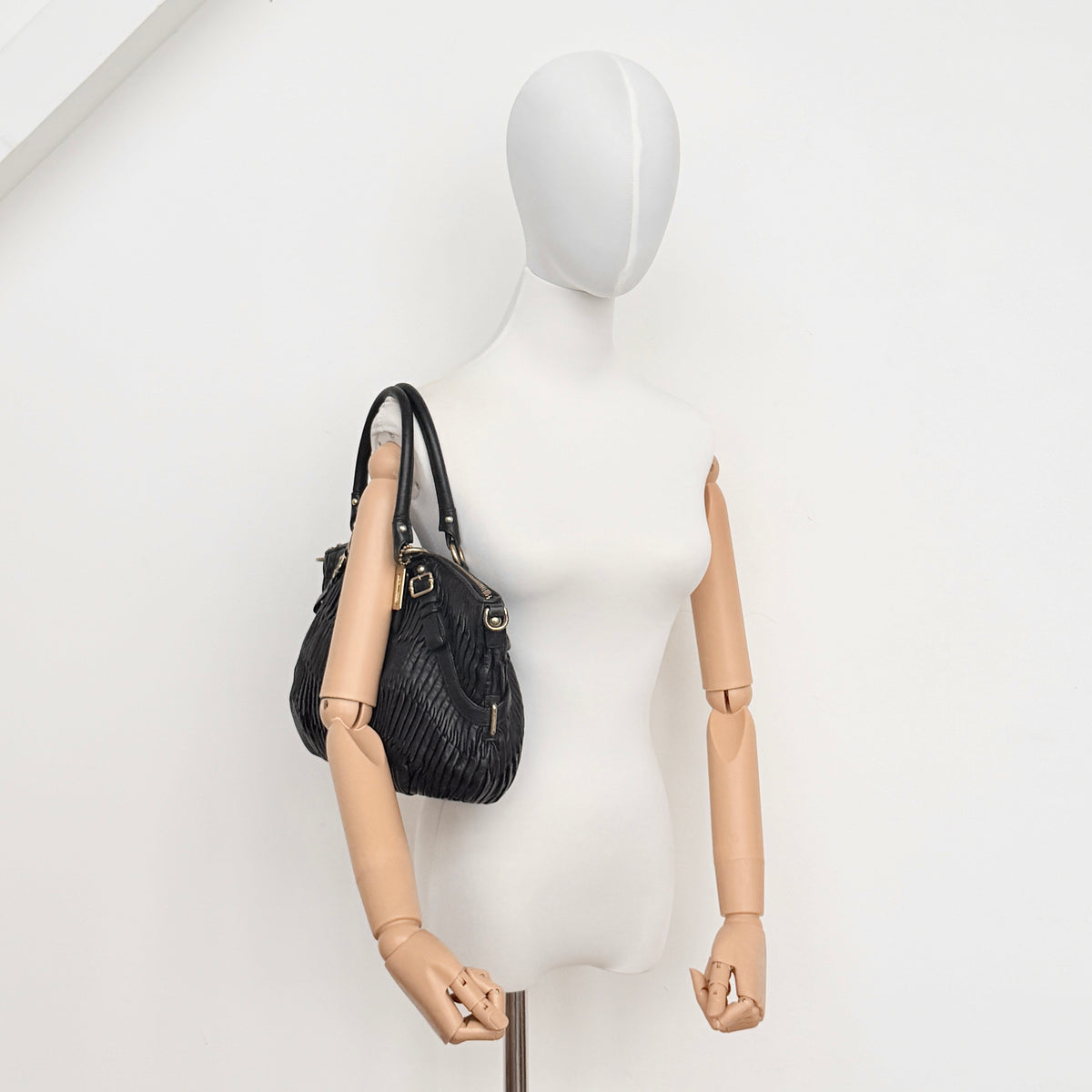Coach Sophia Madison Pleated Shoulder Bag in black leather with gold hardware, displayed with detachable strap and dust bag.