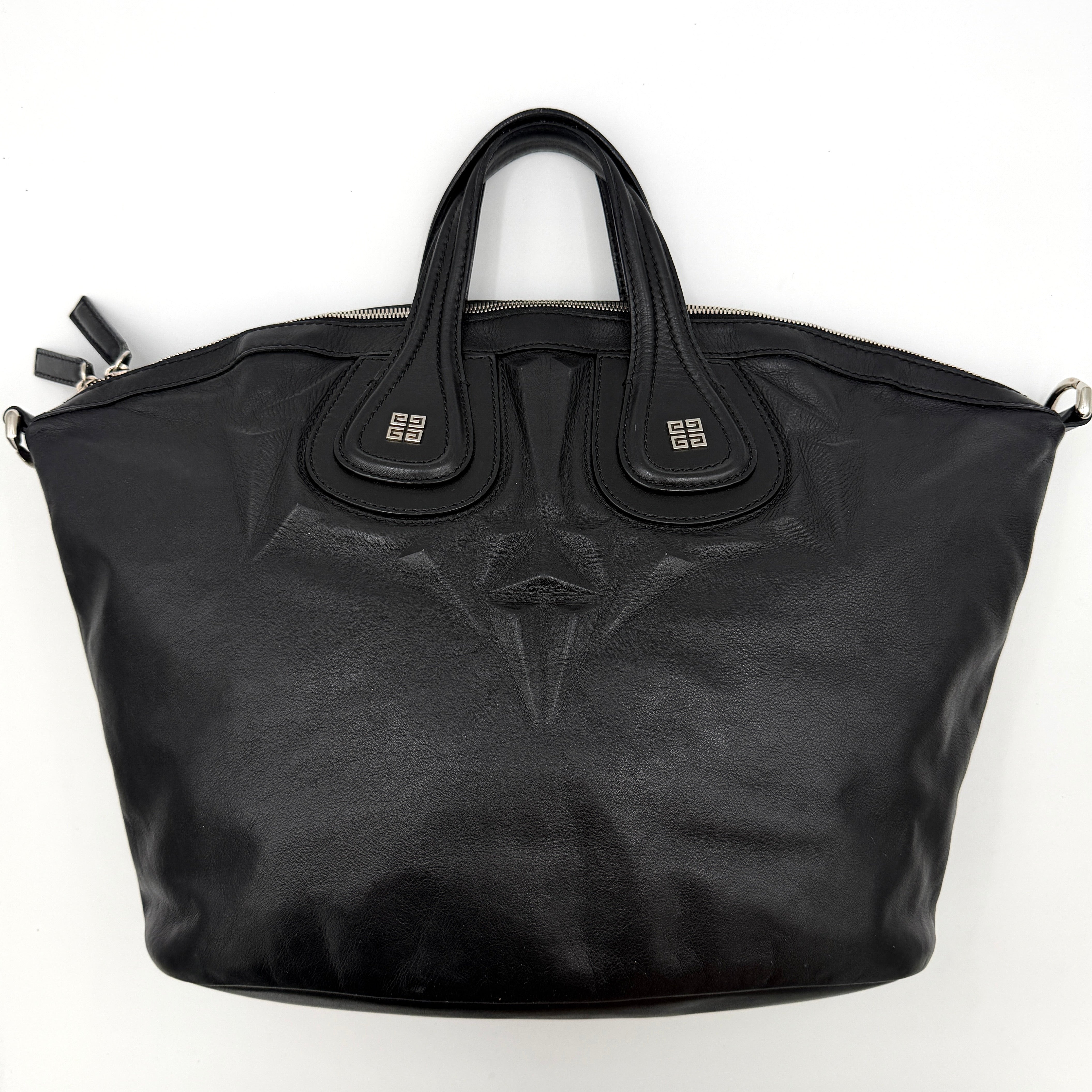 Givenchy 2Way Nightingale Handbag in black leather with detachable strap and striking front motif.