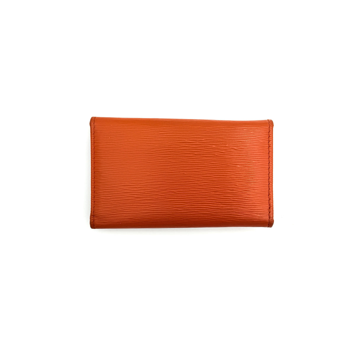 Prada Saffiano leather key case in orange with gold-toned hardware, Prada logo, and authenticity card displayed.