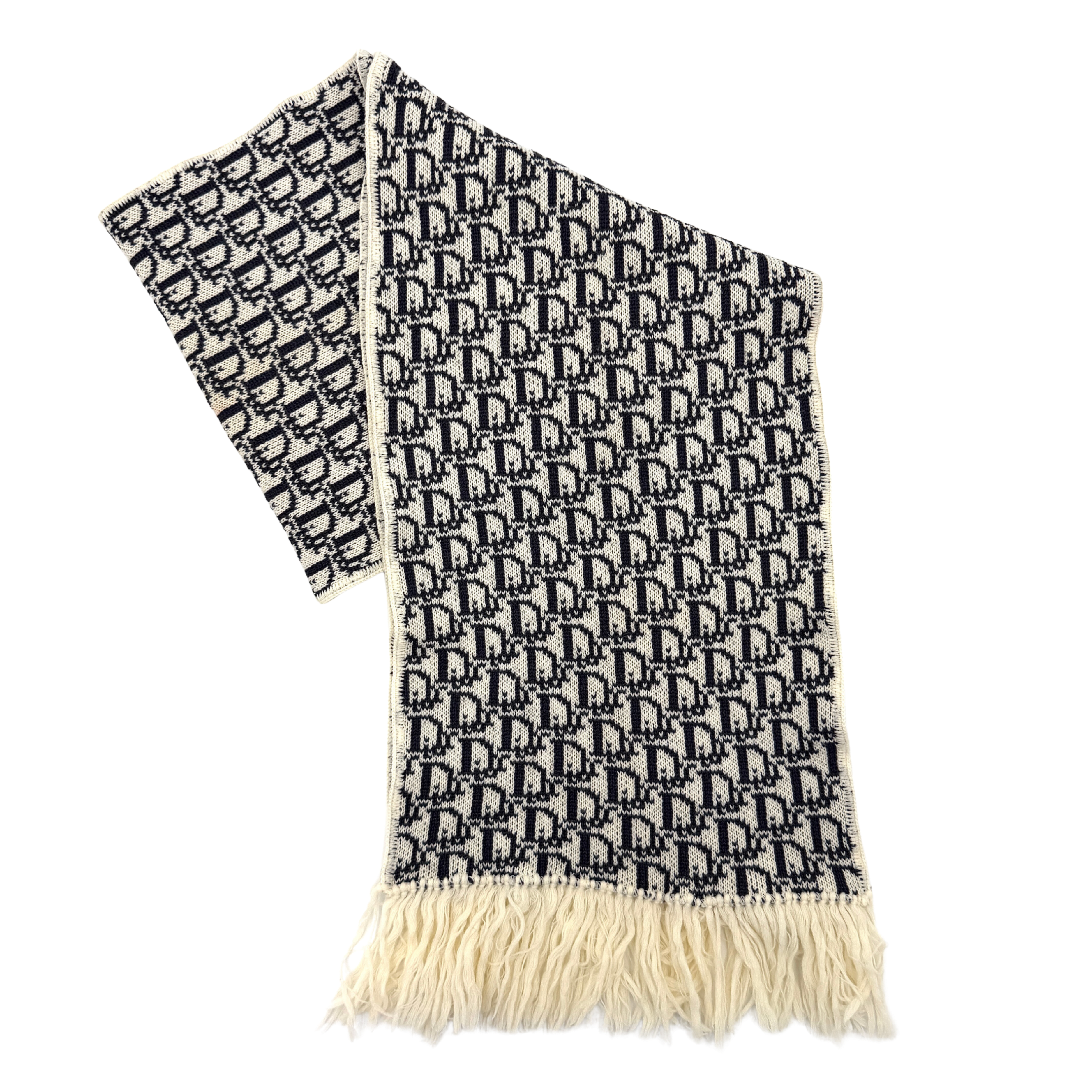 Dior Trotter Monogram wool scarf in white and black with all-over Dior logo pattern and fringe trim, elegantly displayed.