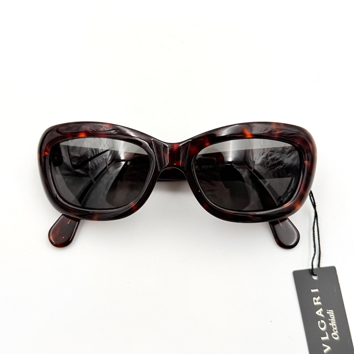 Bvlgari 808 sunglasses in tortoiseshell brown acetate displayed with original case and cloth.