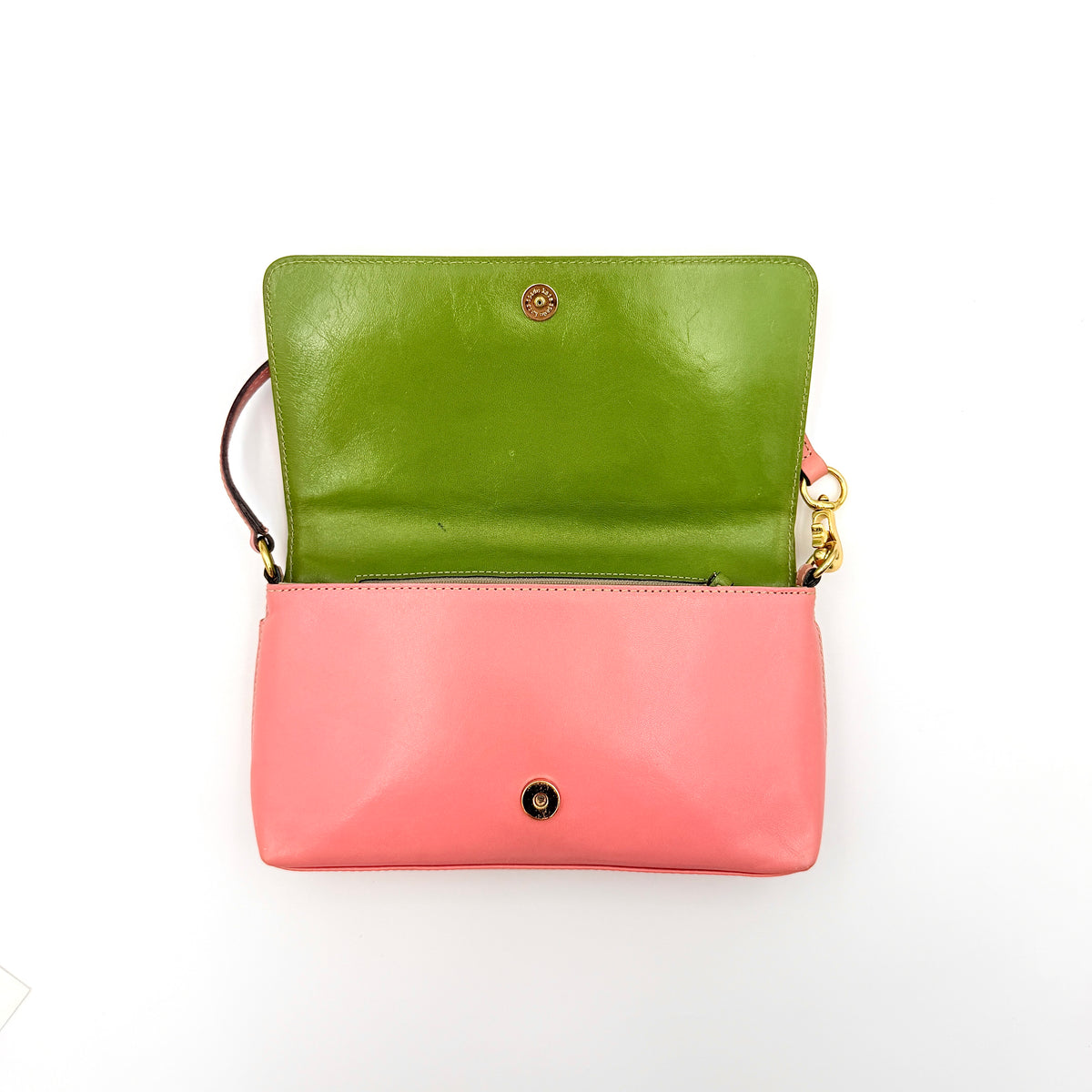 Kate Spade Morgan East West Shoulder Bag in smooth pink leather with gold-tone hardware and a green interior, displayed on white background.