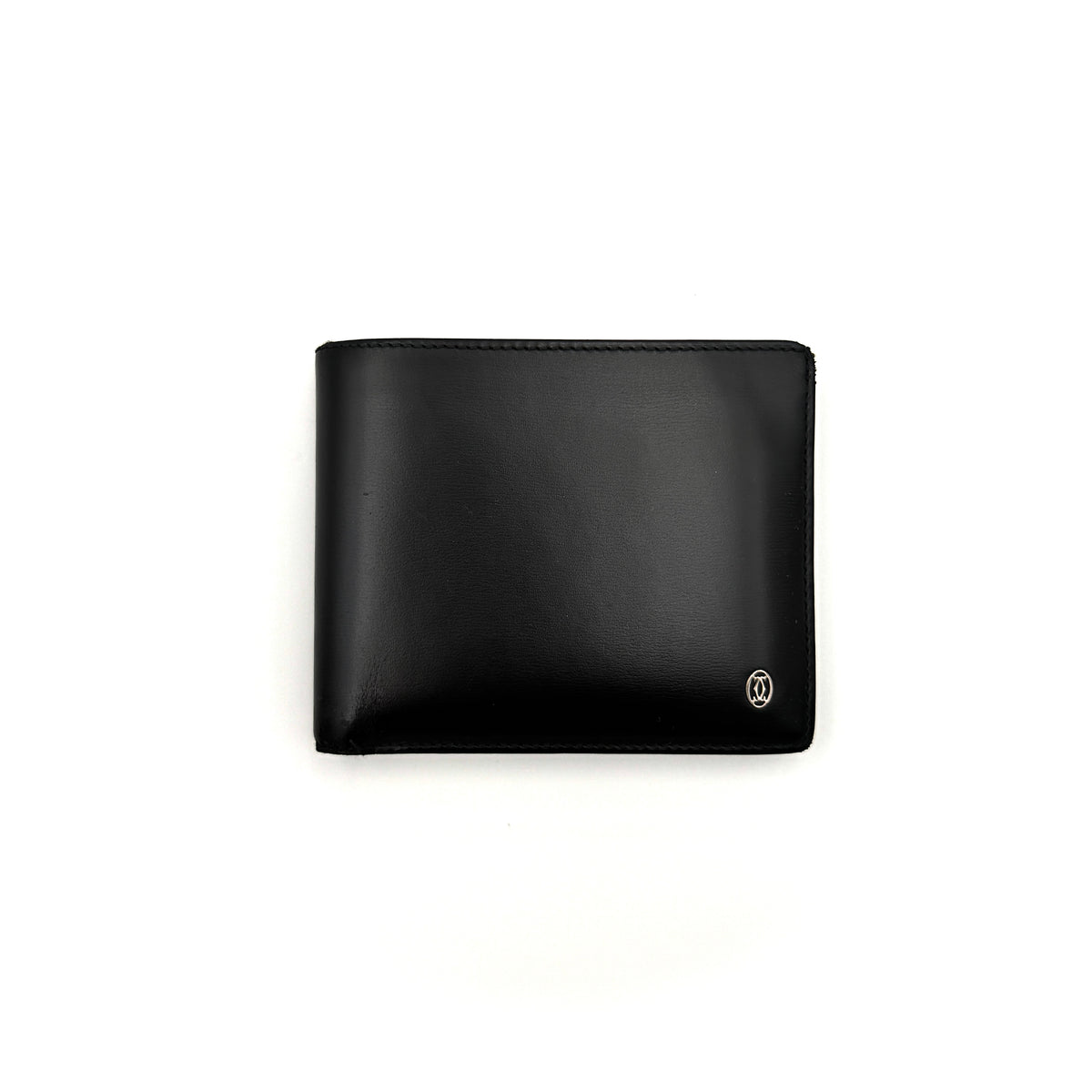 Cartier Must de Cartier black leather bifold wallet, shown with its signature red box and authentication card.