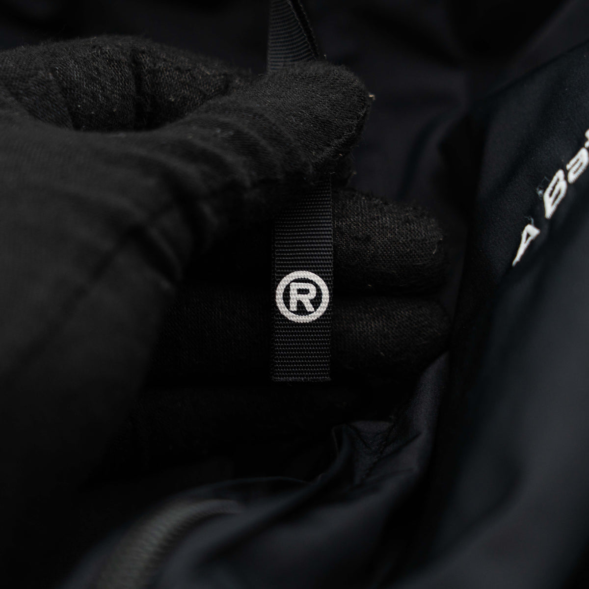 BAPE A Bathing Ape black and white logo track jacket with bold panel detailing, shown laid flat.