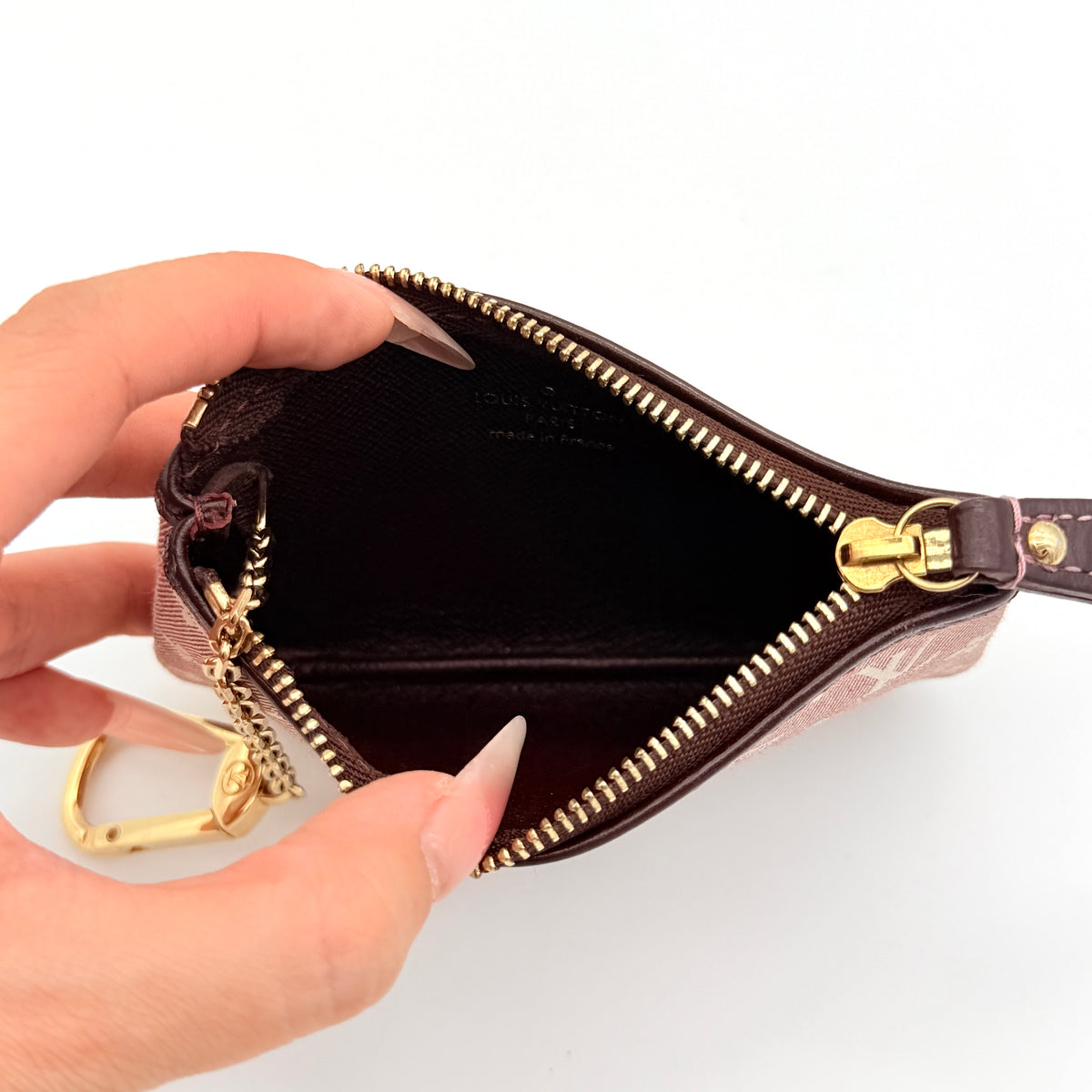 Louis Vuitton Monogram Idylle Pochette Cles Coin Case in sepia pink canvas with gold-tone hardware and monogram pattern.