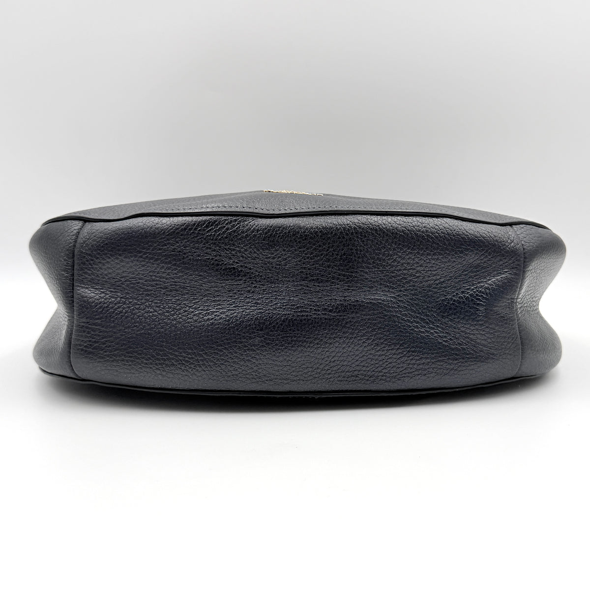 Coach Elle Hobo bag in navy blue pebbled leather with gold hardware and a detachable strap, styled on a white background.