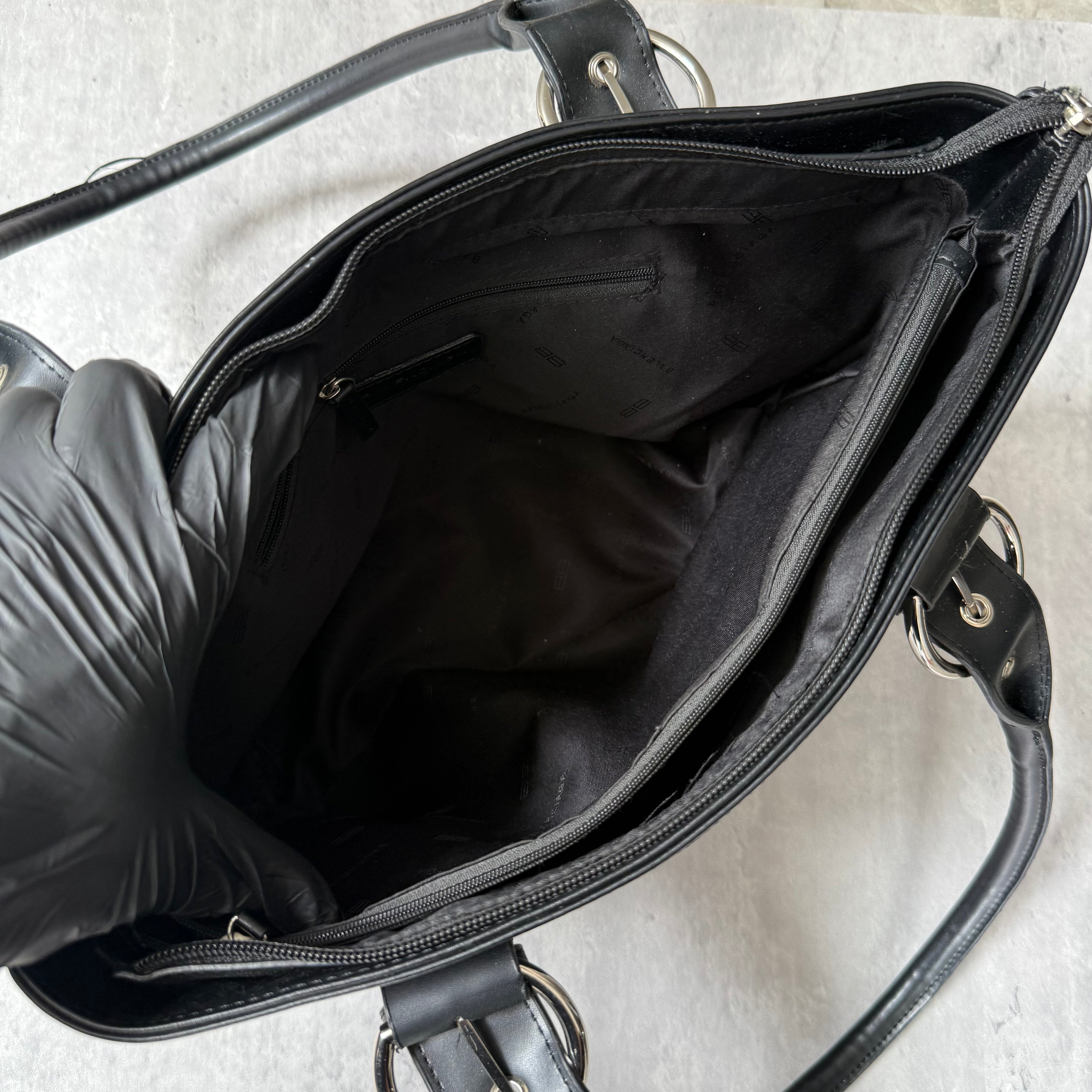 Balenciaga BB Logo Handbag in black canvas with leather trim, dual top handles, and zippered compartment interior.