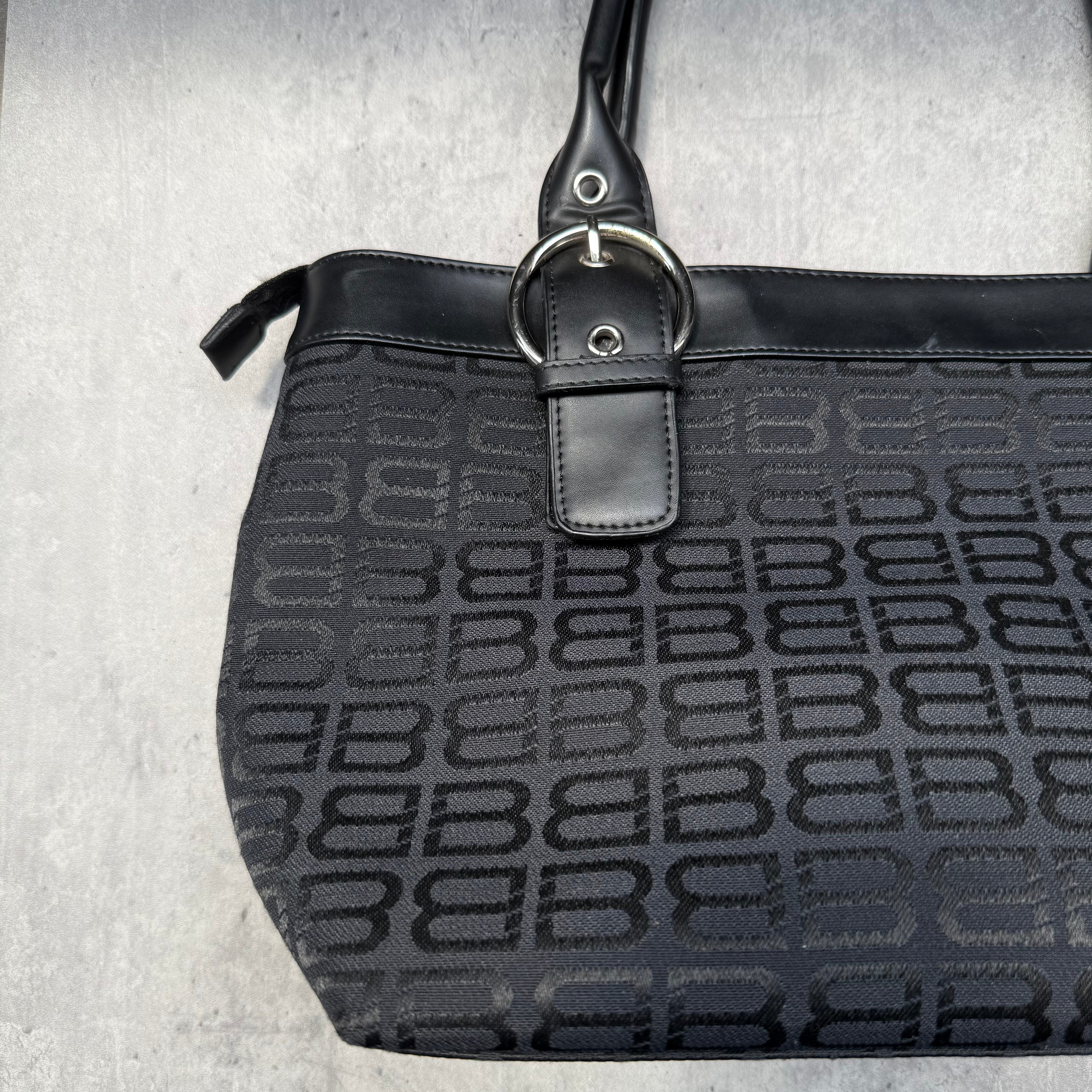 Balenciaga BB Logo Handbag in black canvas with leather trim, dual top handles, and zippered compartment interior.