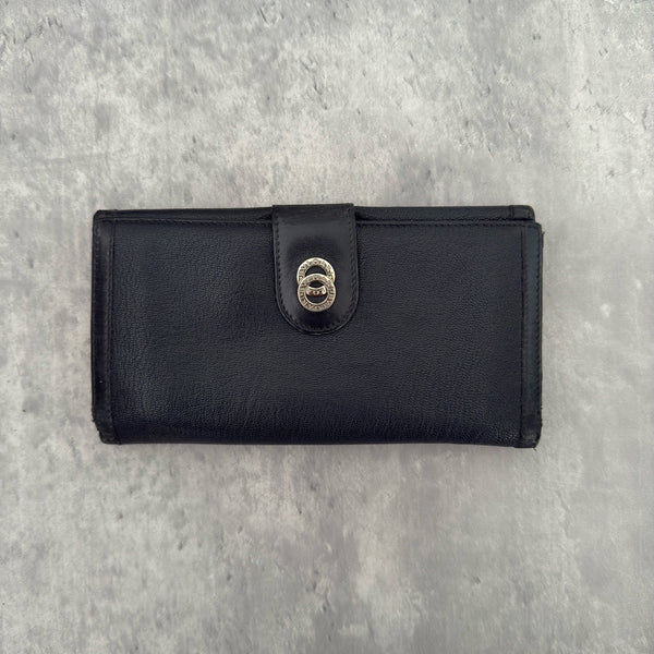 Bvlgari Doppio Tondo Bifold Long Wallet in black leather, featuring a silver-tone logo clasp, red fabric interior, and multiple compartments.