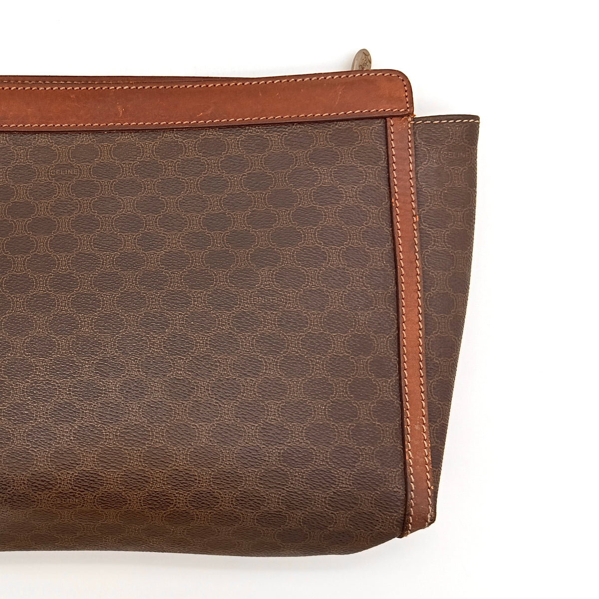 Celine Triomphe Macadam Clutch Bag in brown coated canvas with leather trim, photographed on a white background.