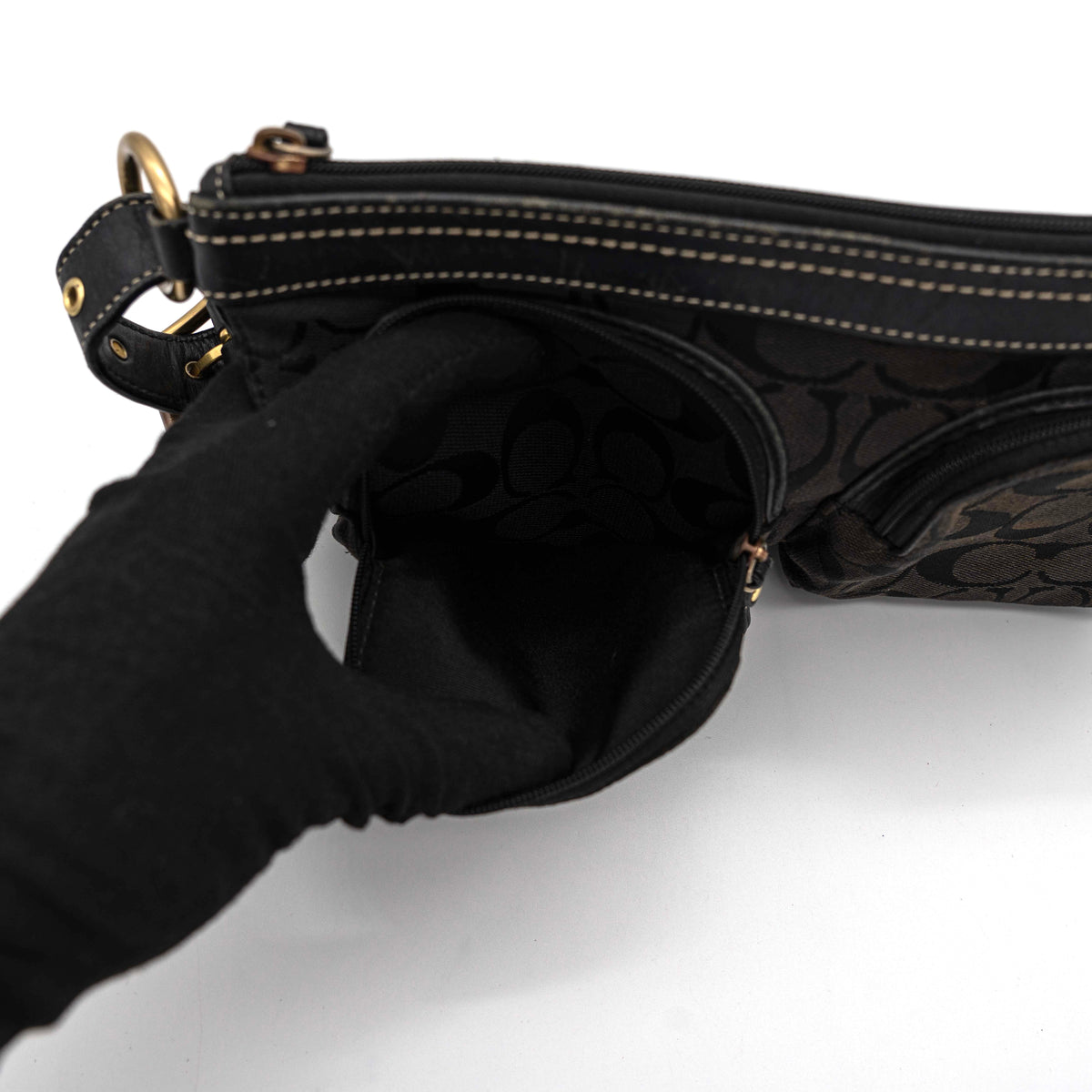 Coach Signature Double Pocket Shoulder Bag in black jacquard with dual zip pockets and an adjustable leather strap.