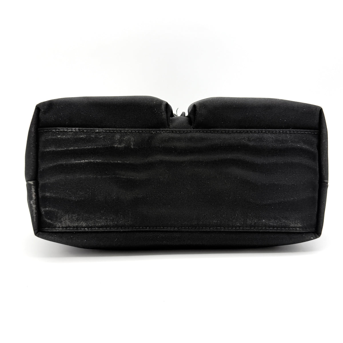 Front view of the Gucci black nylon tote with dual zip pockets and leather top handles.