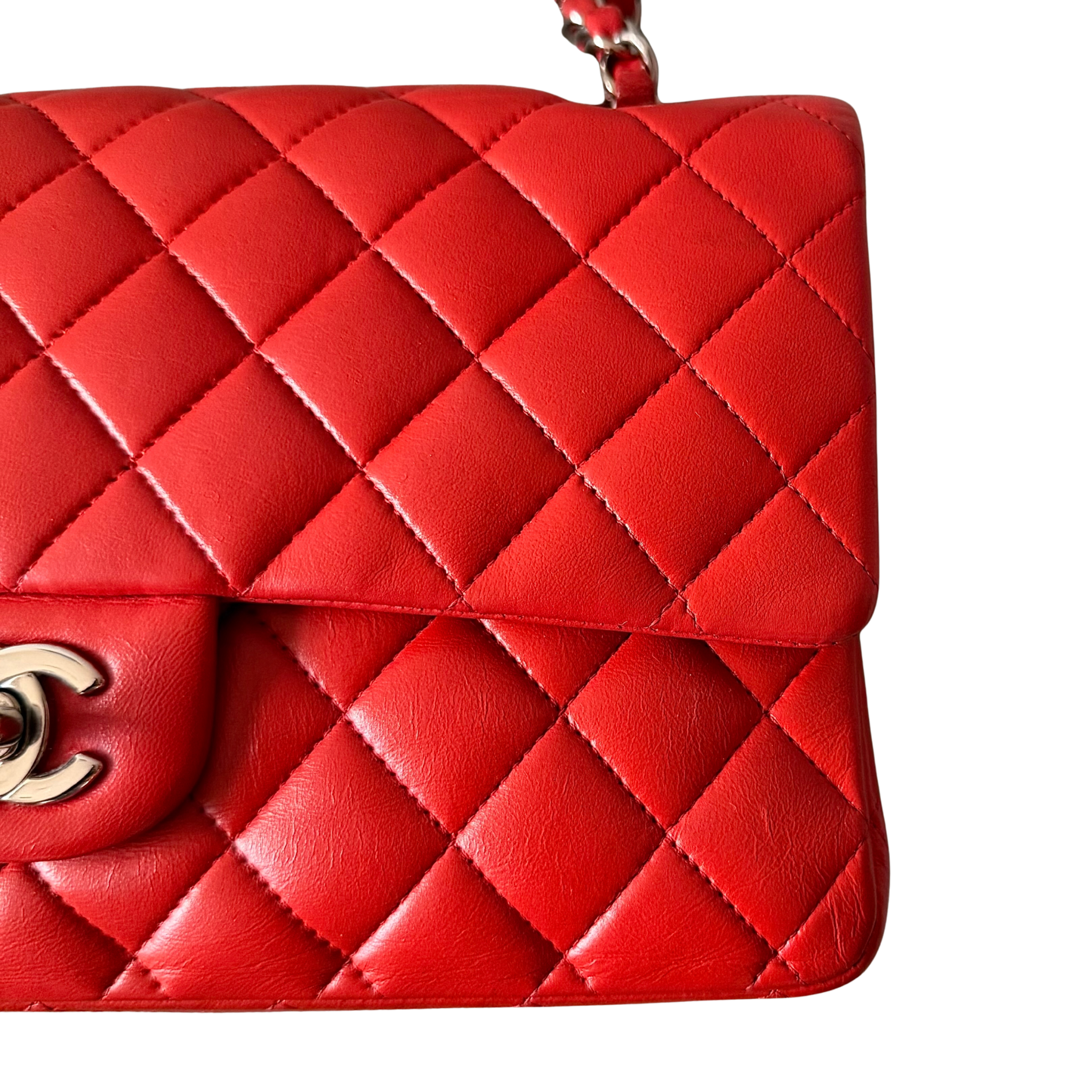 Chanel double flap shoulder bag in quilted red leather with silver-tone hardware and chain leather strap.
