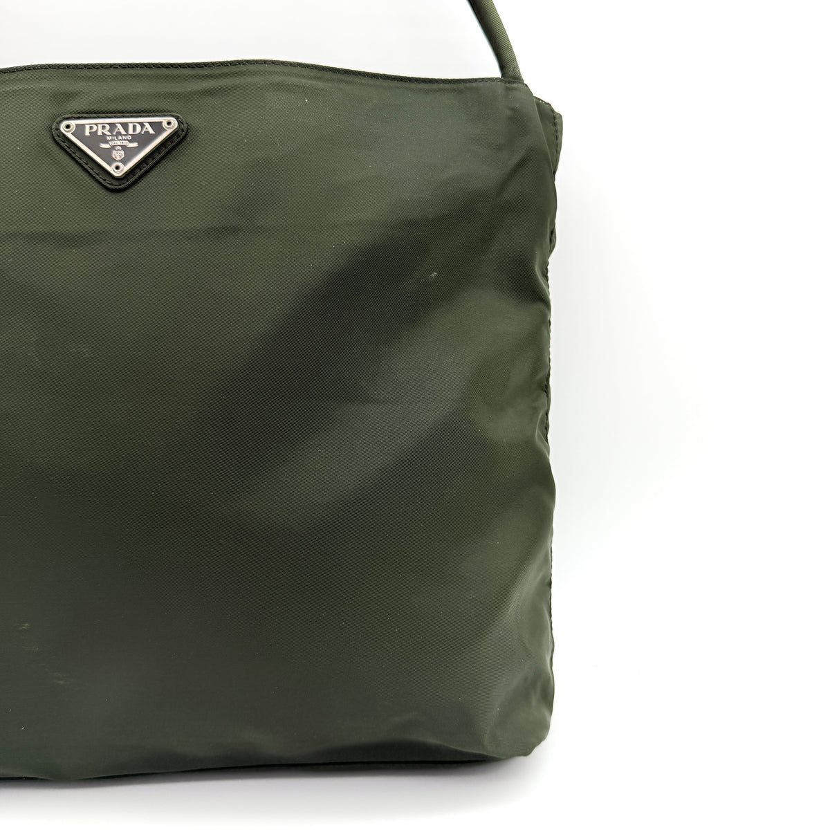 Prada Tessuto Nylon City Tote Bag in dark green nylon with double handles and signature triangle logo plaque on the front.