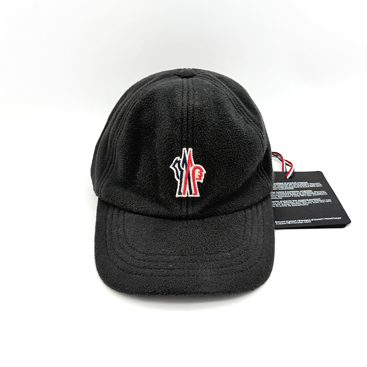 Moncler Grenoble black fleece baseball cap with tri-colour logo patch on the front and tonal embroidery details.