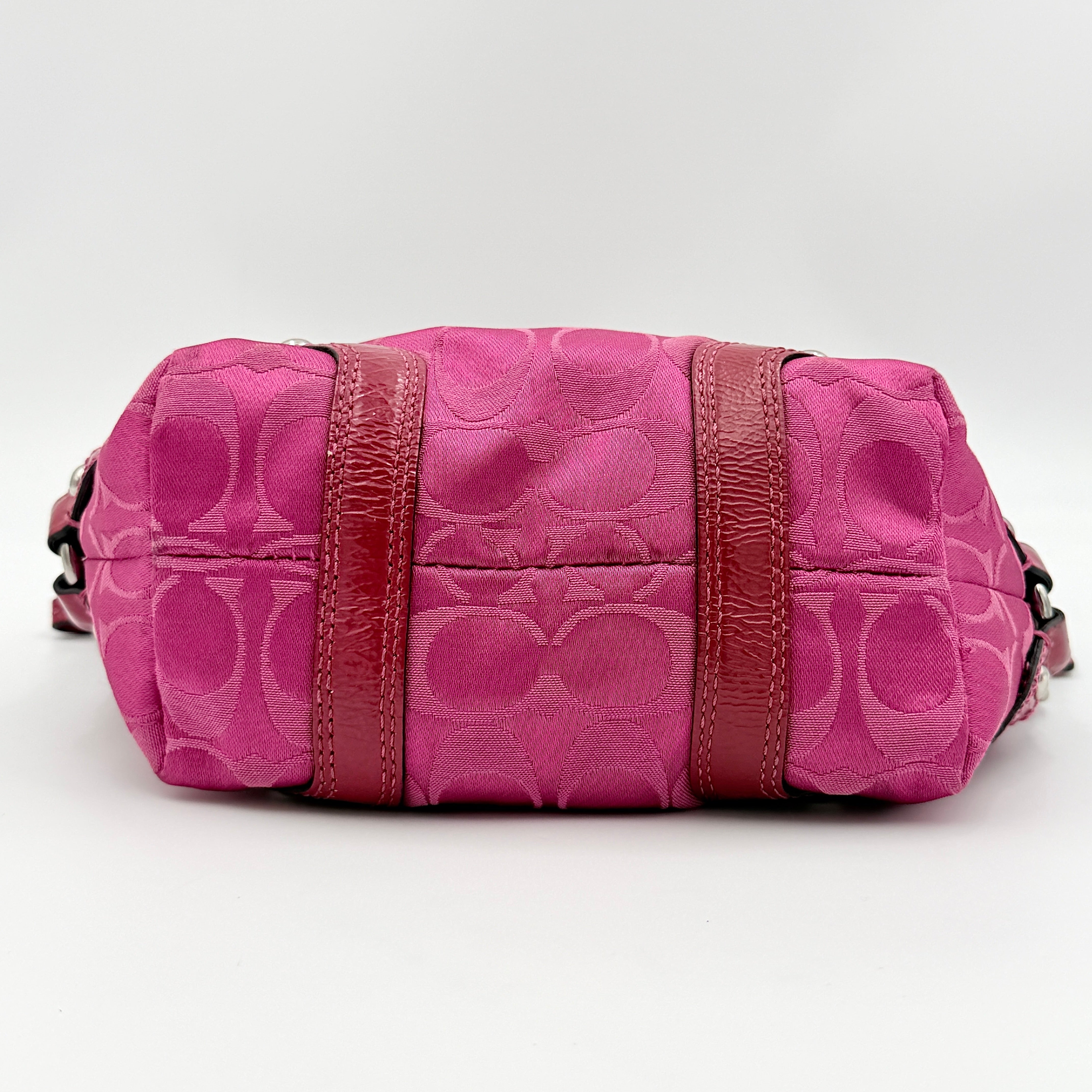 Coach Carly Hobo Shoulder Bag in vivid pink jacquard and leather, featuring signature chain detail and silver hardware.
