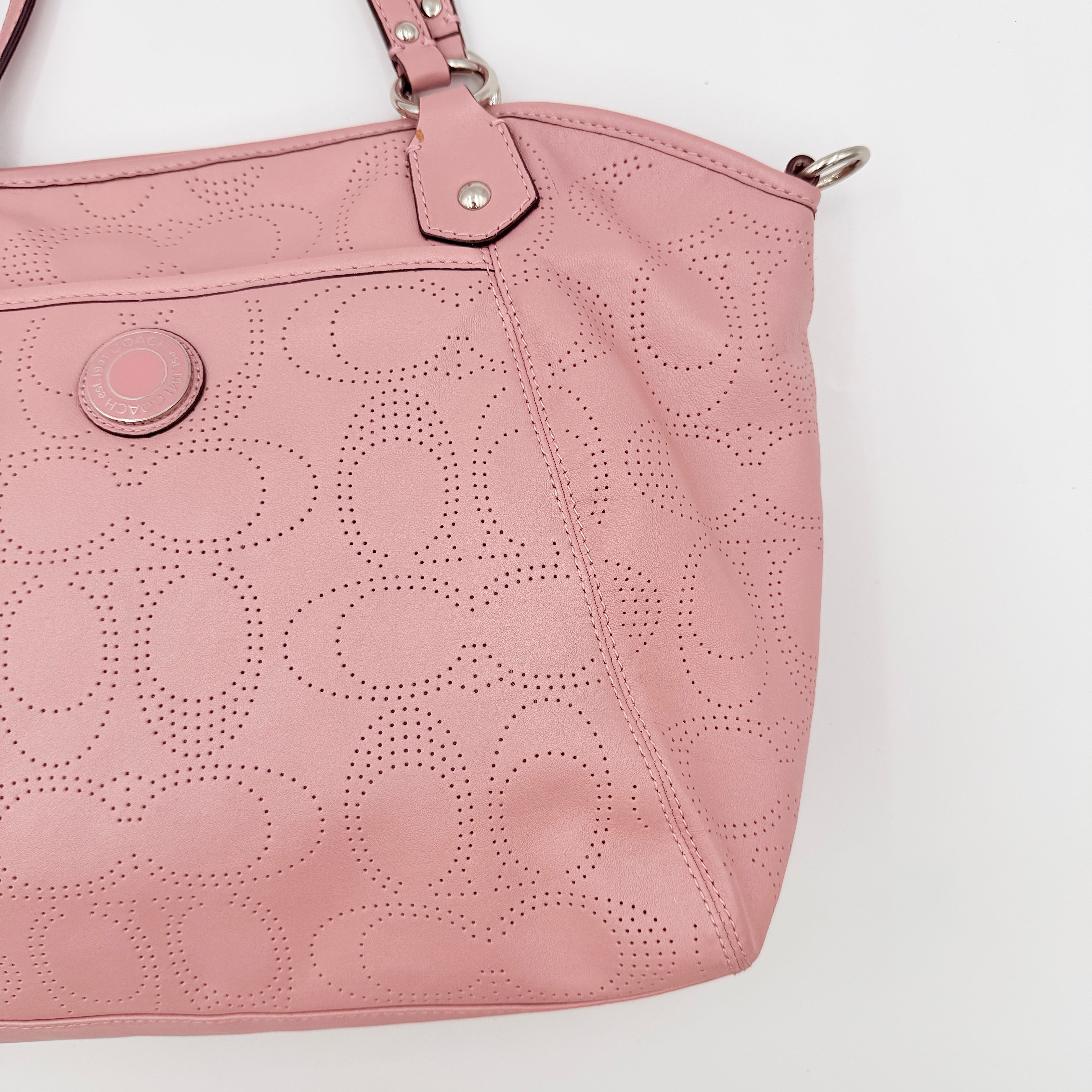 Coach 2Way Perforated Shoulder Bag in soft pink leather with silver hardware and detachable strap, displayed on a white background.