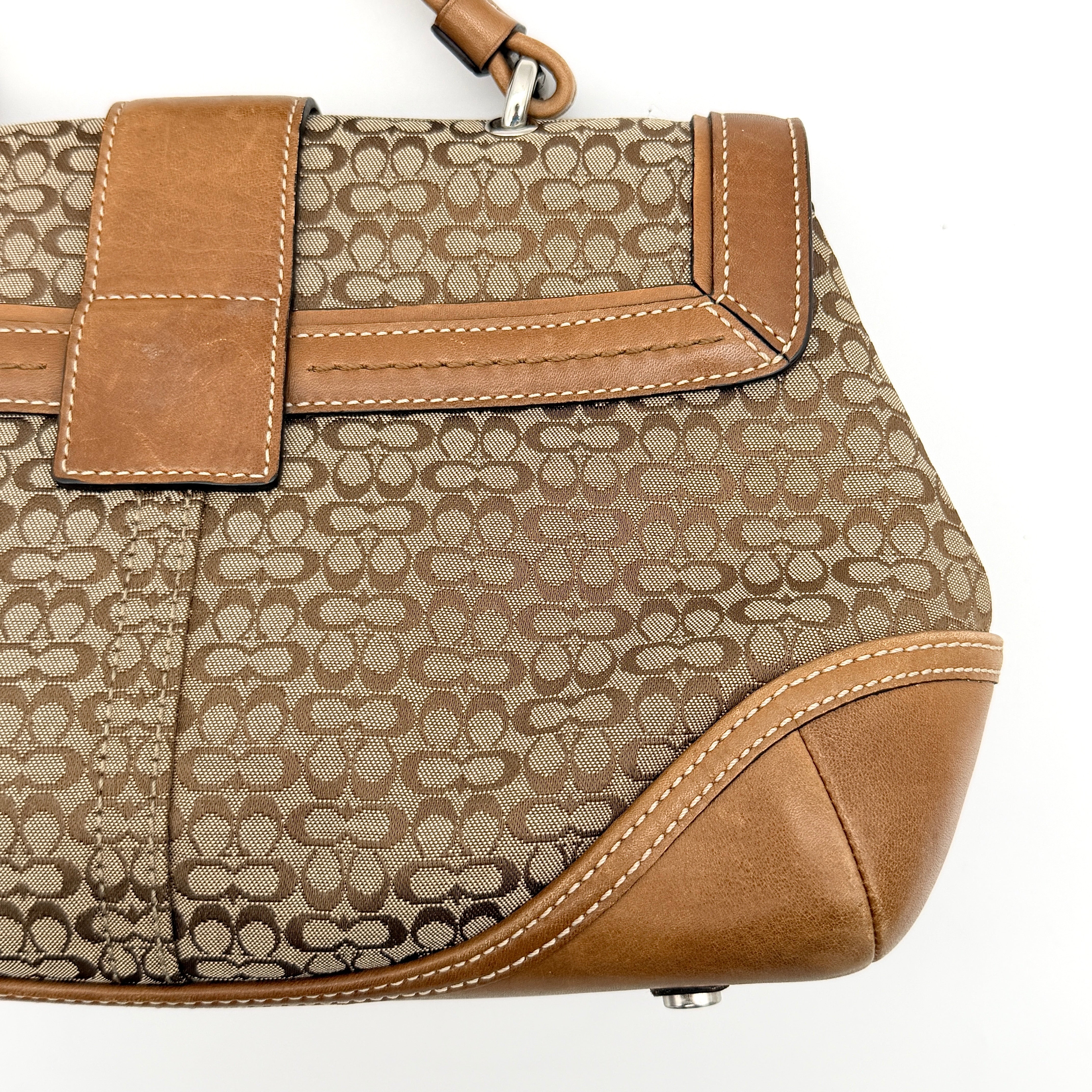 Coach Signature Soho Shoulder Bag in beige and tan monogram canvas with tan leather trim, shown on white background.