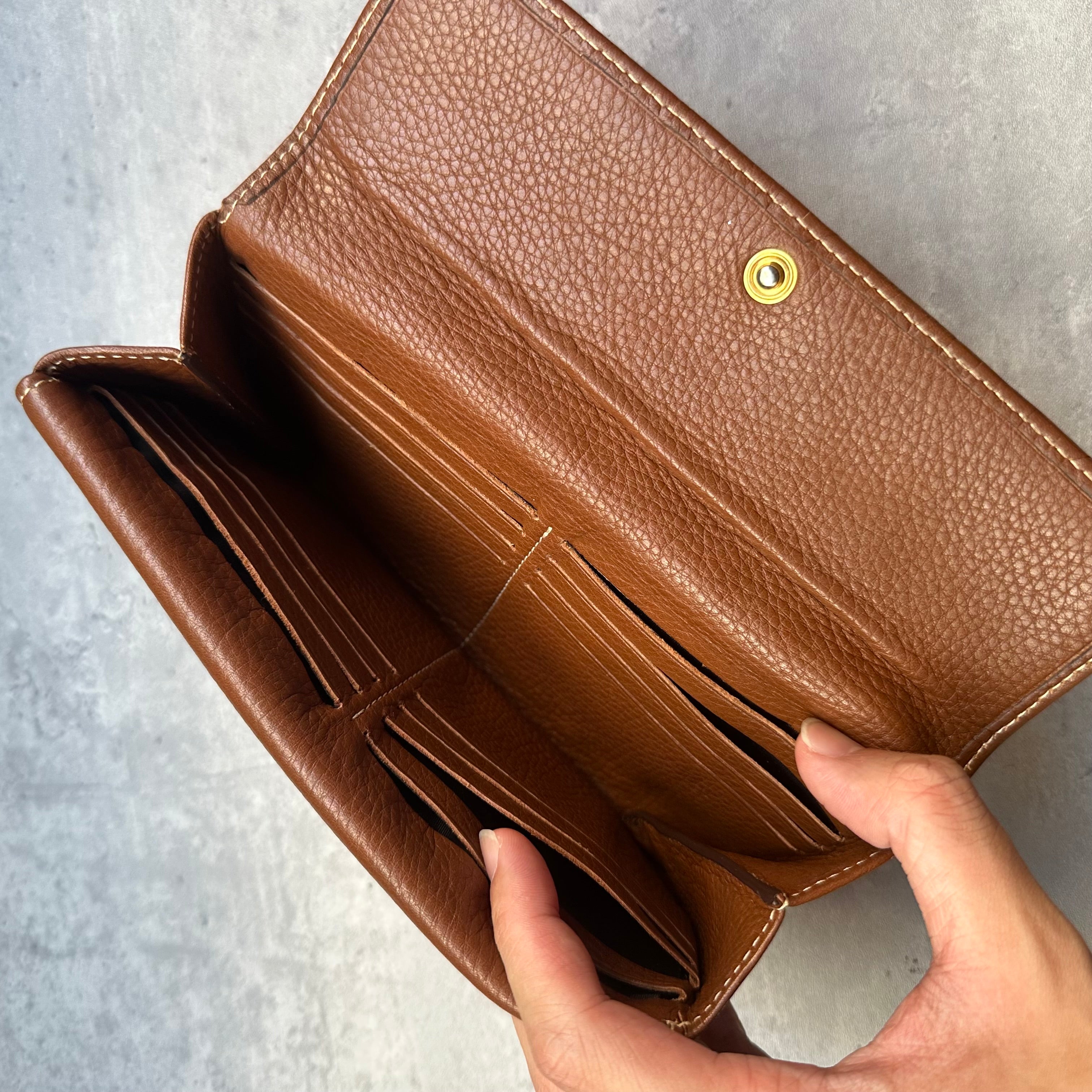 Inside view of Carolina Herrera wallet featuring multiple card slots and compartments