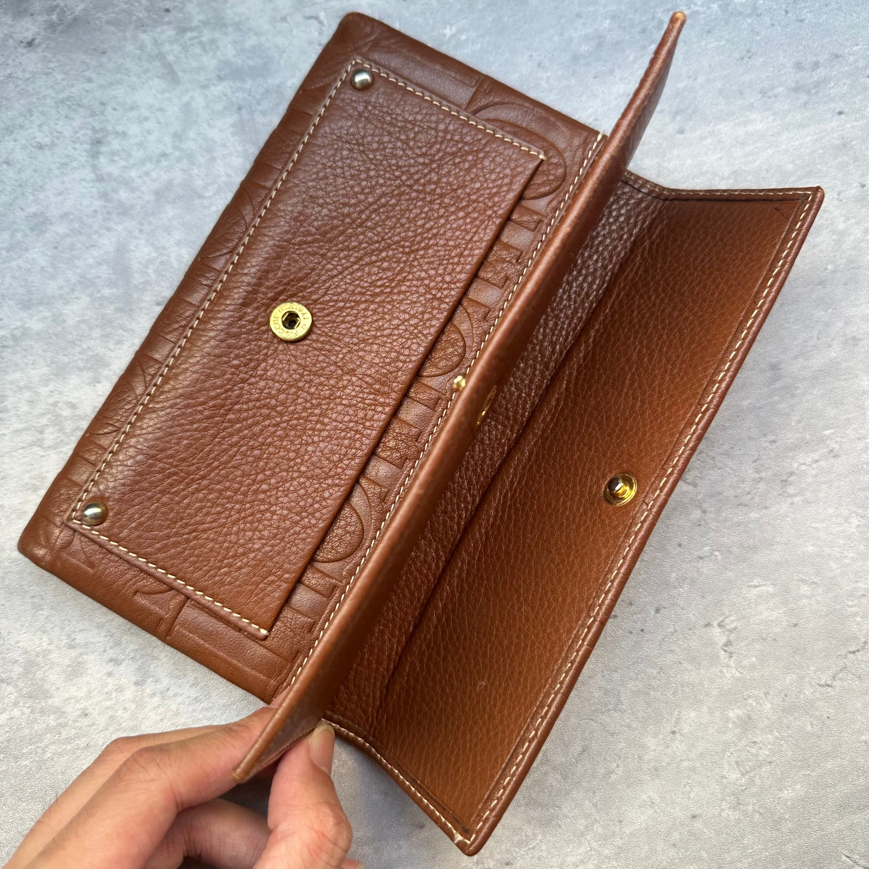 Side view of Carolina Herrera wallet open showing bill compartment