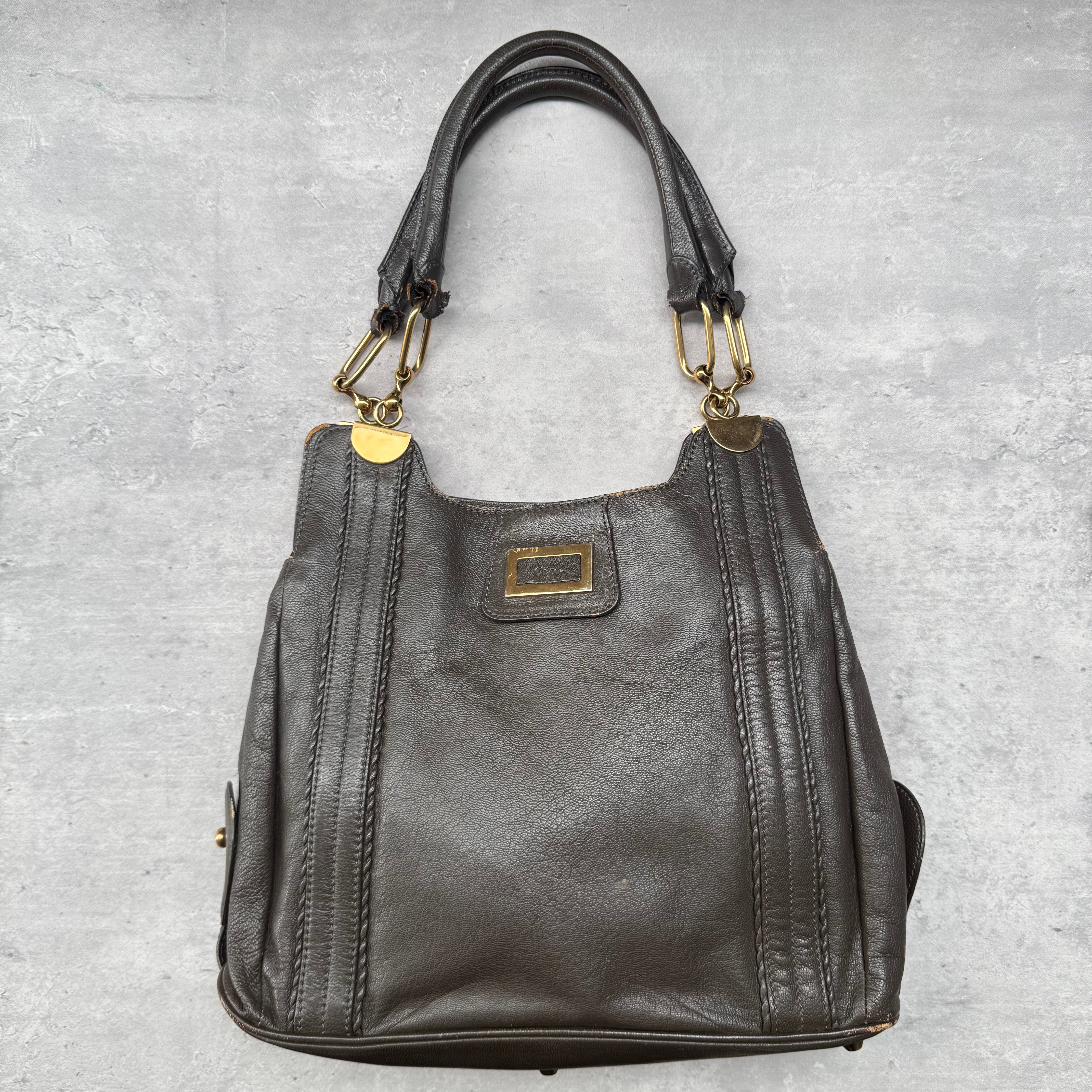 Chloé Irene Leather Shoulder Bag in brown with gold-tone hardware, central zip compartment, and dual rolled handles.