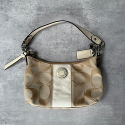 Coach 2-Way Signature Stripe Shoulder Bag in Beige and White with detachable strap, zip closure, and central white leather stripe with metal Coach emblem