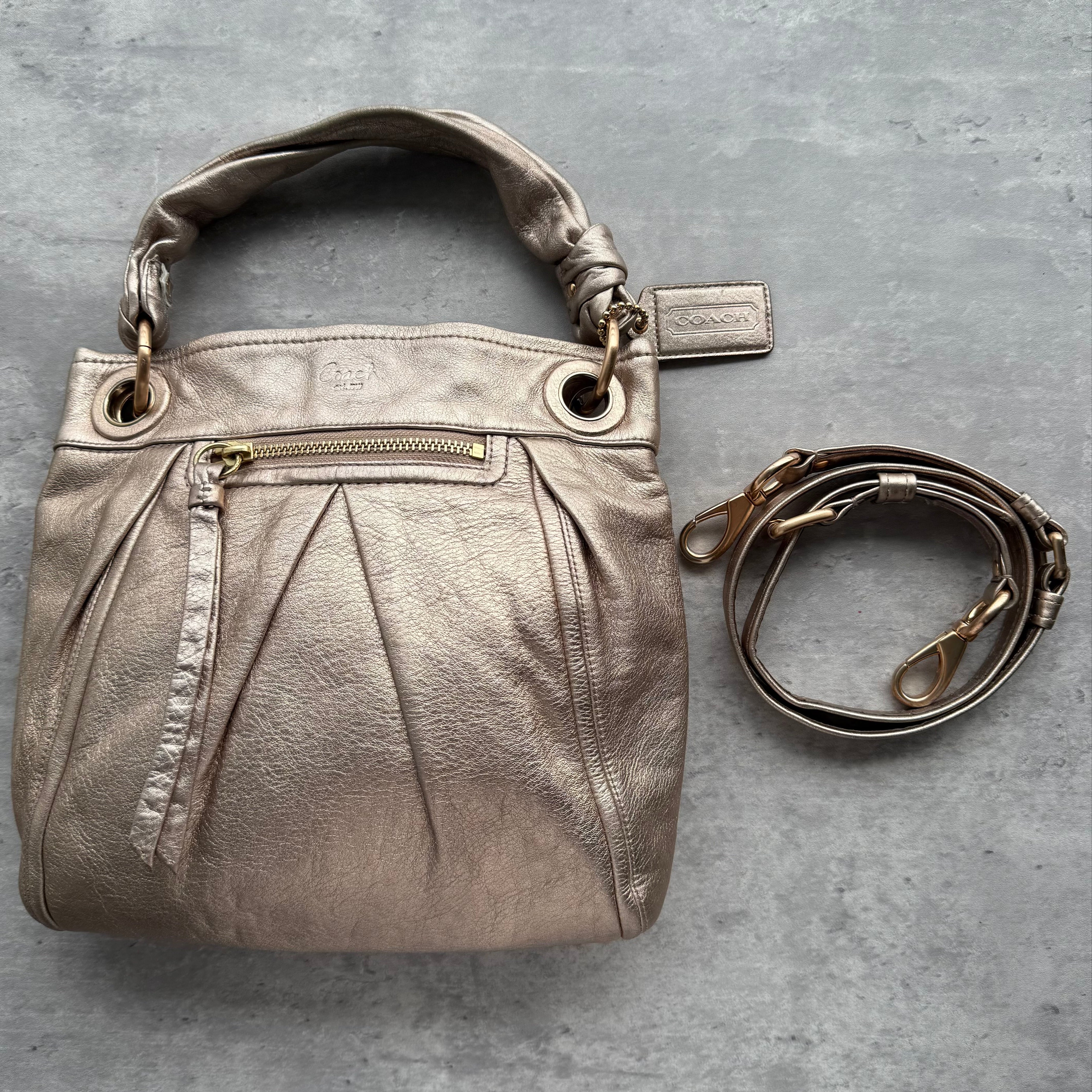 Coach Parker 2Way Leather Hobo Shoulder Bag in metallic rose gold leather with knotted handle, detachable strap, pleated design, and blush pink interior.