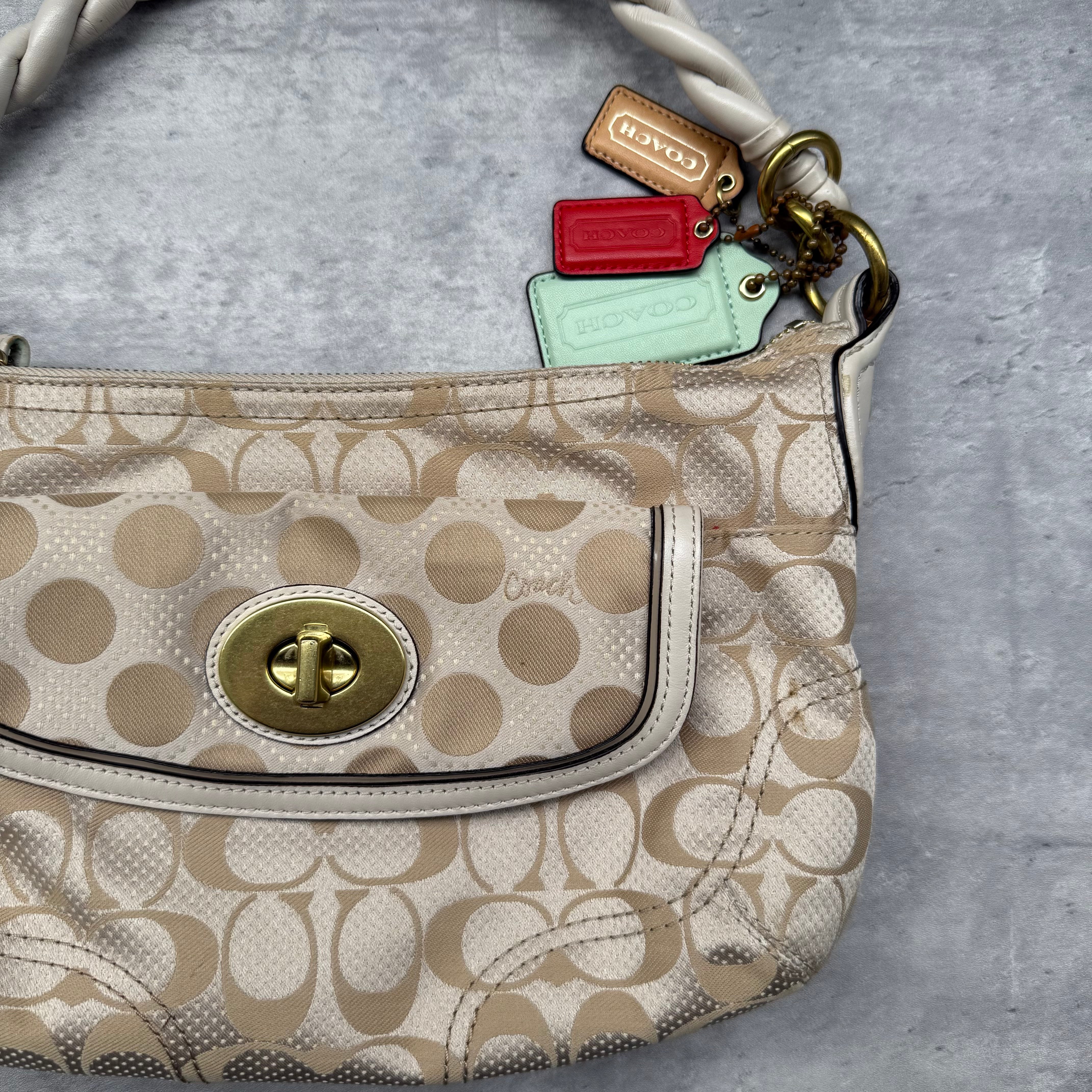 Coach 2Way Signature Dot Satin Canvas Shoulder Bag in beige with braided handle, turn-lock pocket, colorful hang tags, and red interior
