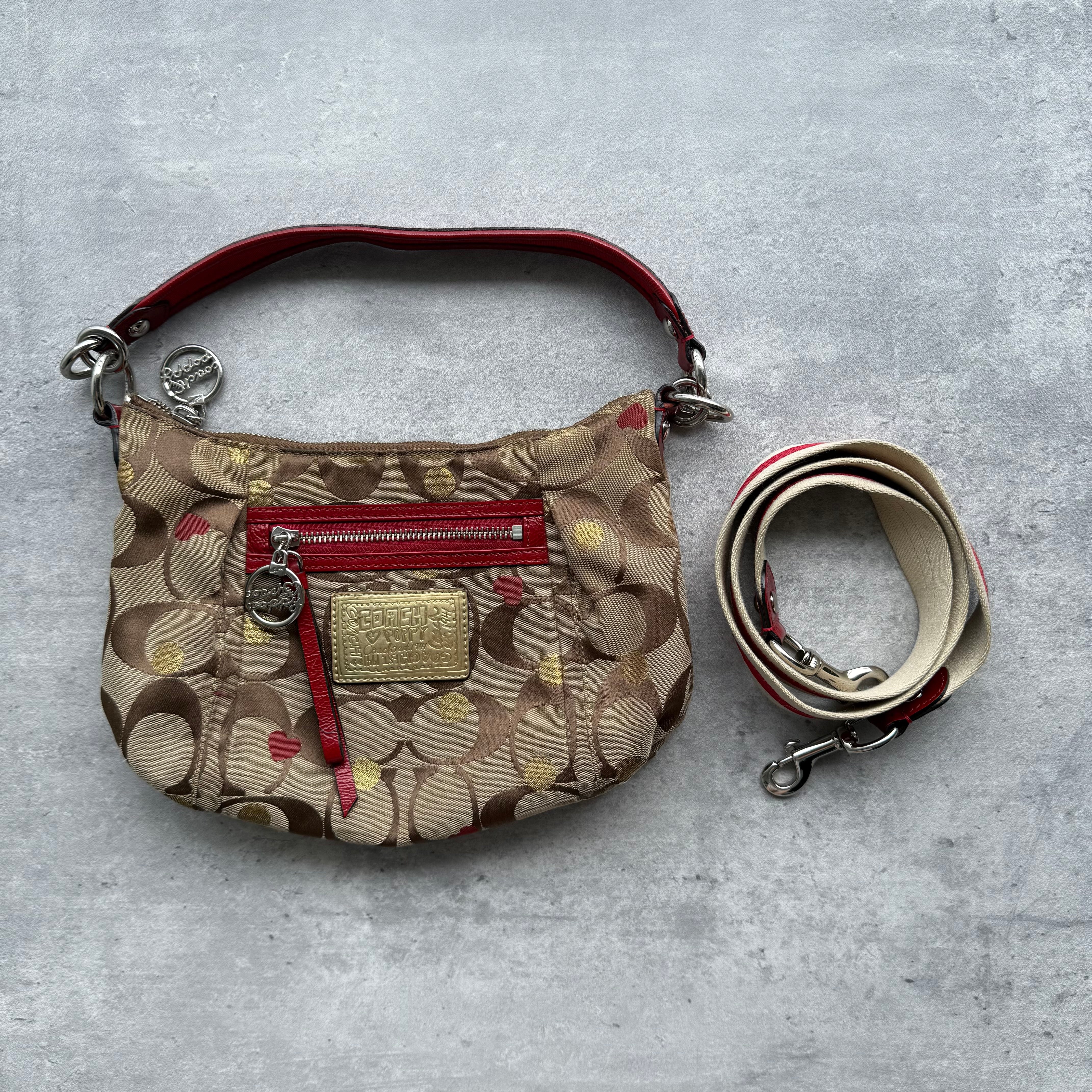 Coach 2Way Signature Heart Shoulder Bag in beige jacquard with red heart print and red leather trim, featuring gold-tone plaque and detachable strap