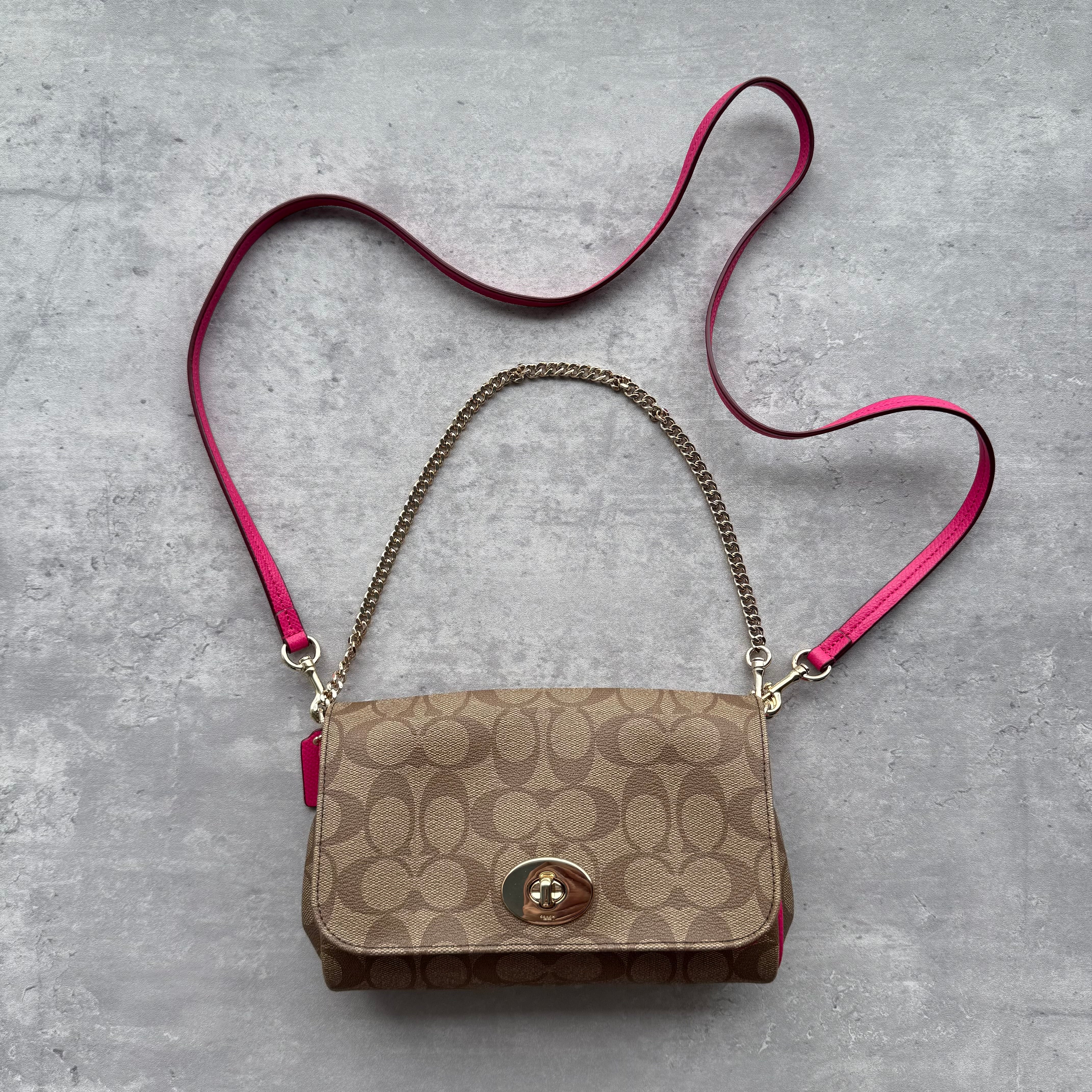 Coach 2Way Signature Ruby Shoulder Bag in beige monogram canvas with pink leather trim, gold chain handle, and turn-lock closure