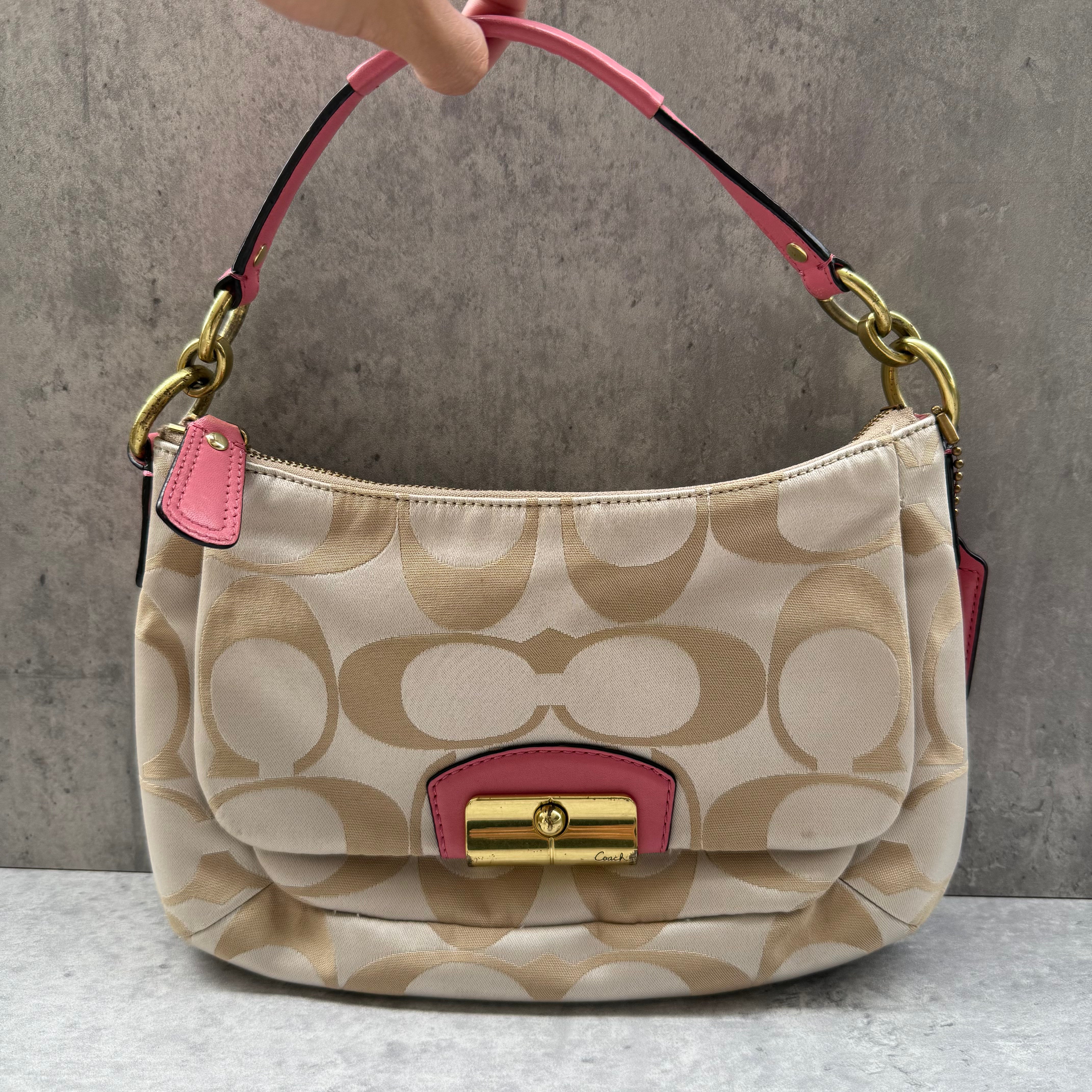 Coach 2Way Signature Shoulder Bag Cream/Pink with gold-tone turn-lock, pink leather trim, and cream monogram canvas