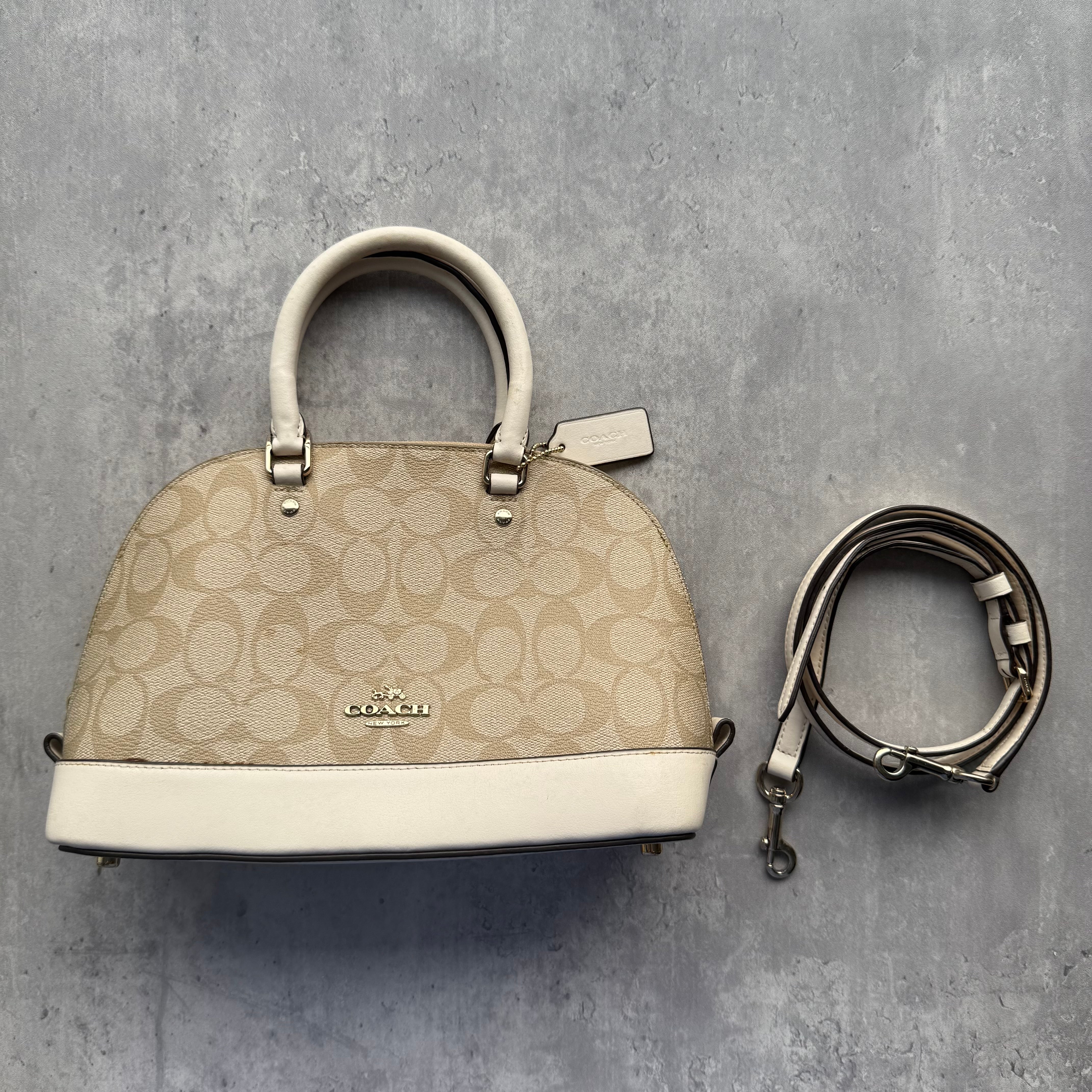 Coach 2Way Signature Sierra Hand Bag in beige monogram coated canvas with cream leather trim, gold-tone hardware, and detachable strap.