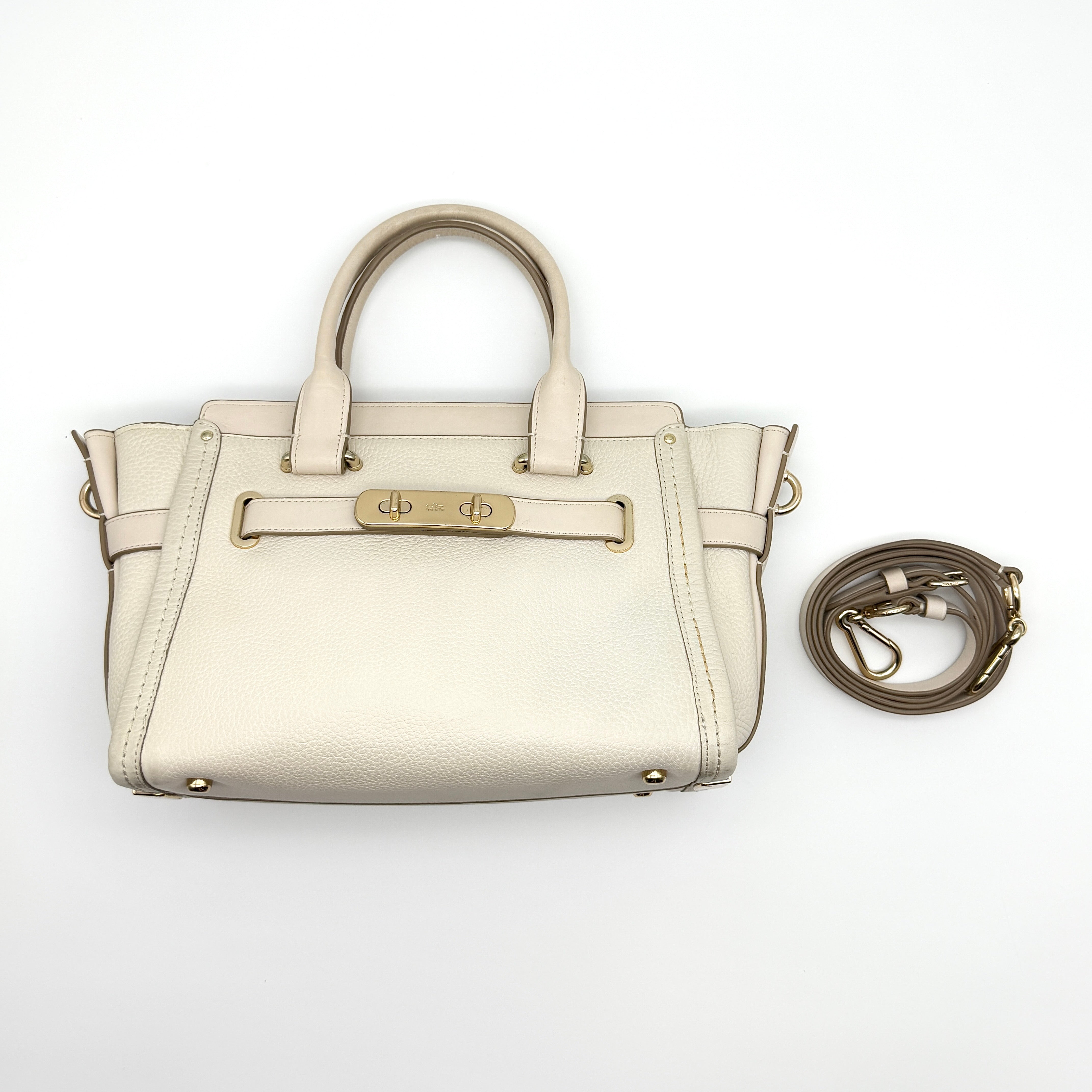 Coach 2Way Swagger Carryall Handbag in white pebbled leather with gold-tone turn-lock hardware and detachable strap.