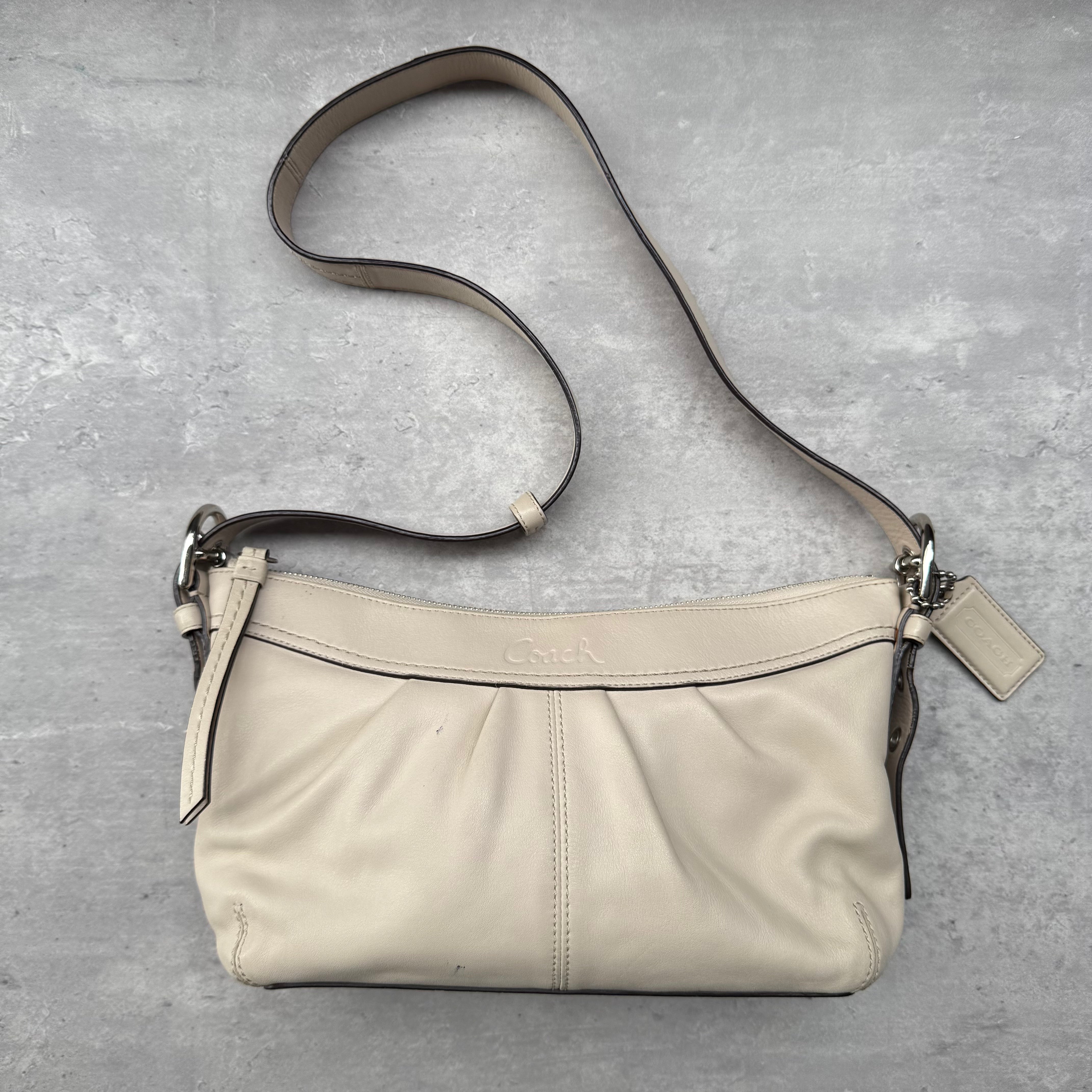 Coach Ashley Swingpack Crossbody Bag in white leather with silver-tone hardware and adjustable strap.