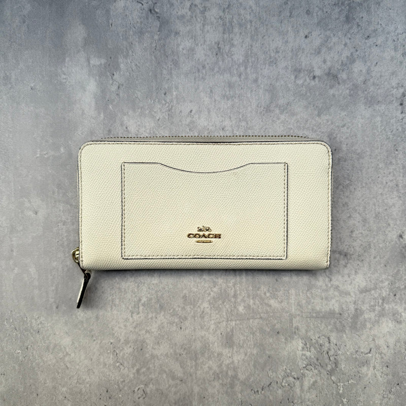 Coach Crossgrain Leather Zip Wallet Chalk White, featuring a zip-around design, external pocket, and gold-tone logo.