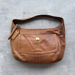 Vintage Coach Ergo Hobo Shoulder Bag in brown leather with gold-tone hardware, contrast stitching, front pocket, and zip closure