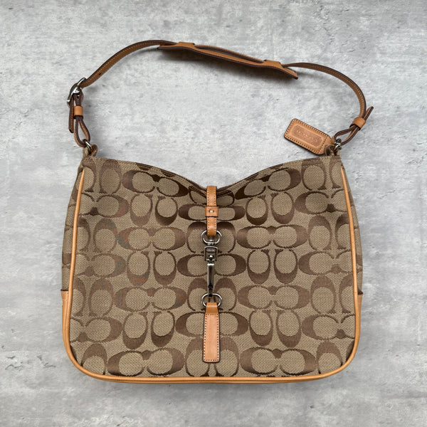 Coach Hobo Signature Clip Canvas Handbag Beige with monogram jacquard canvas, tan leather trim, front clip accent, and red-orange interior lining