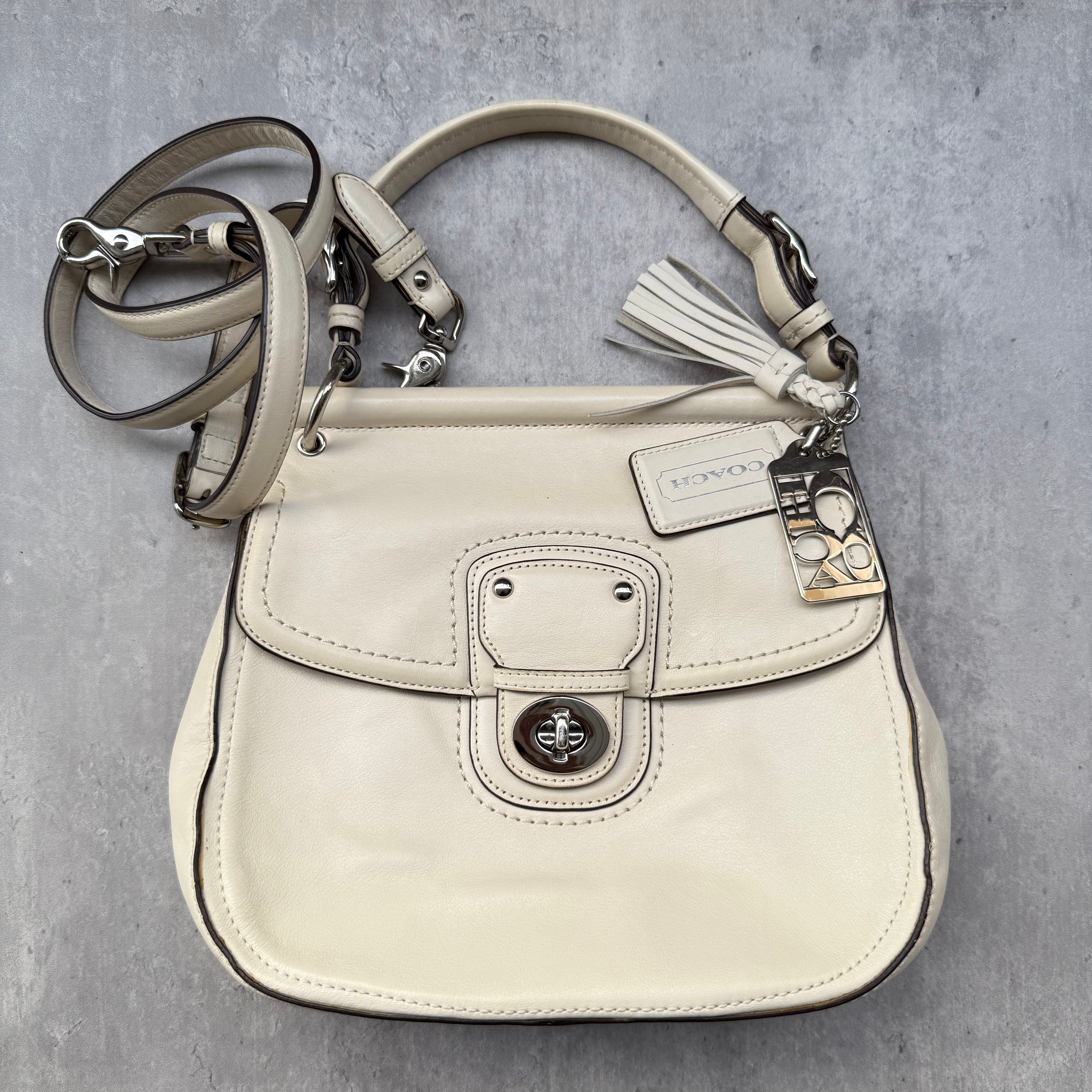 Coach Legacy Willis Tassel Handbag White with top handle, extra crossbody strap, and striped interior lining